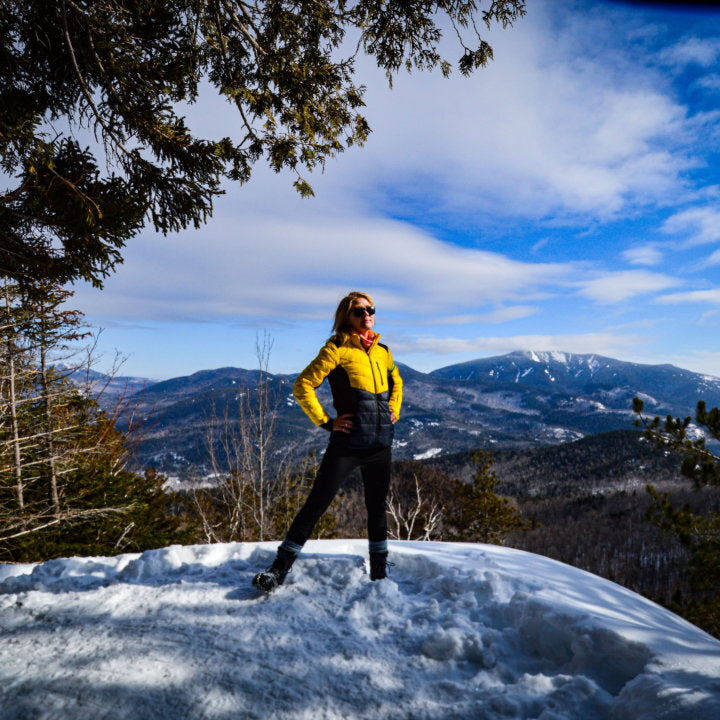 EcoDown Jacket for women in yellow, featuring a lightweight design, built-in sleeve gloves, and a water-repellent finish.