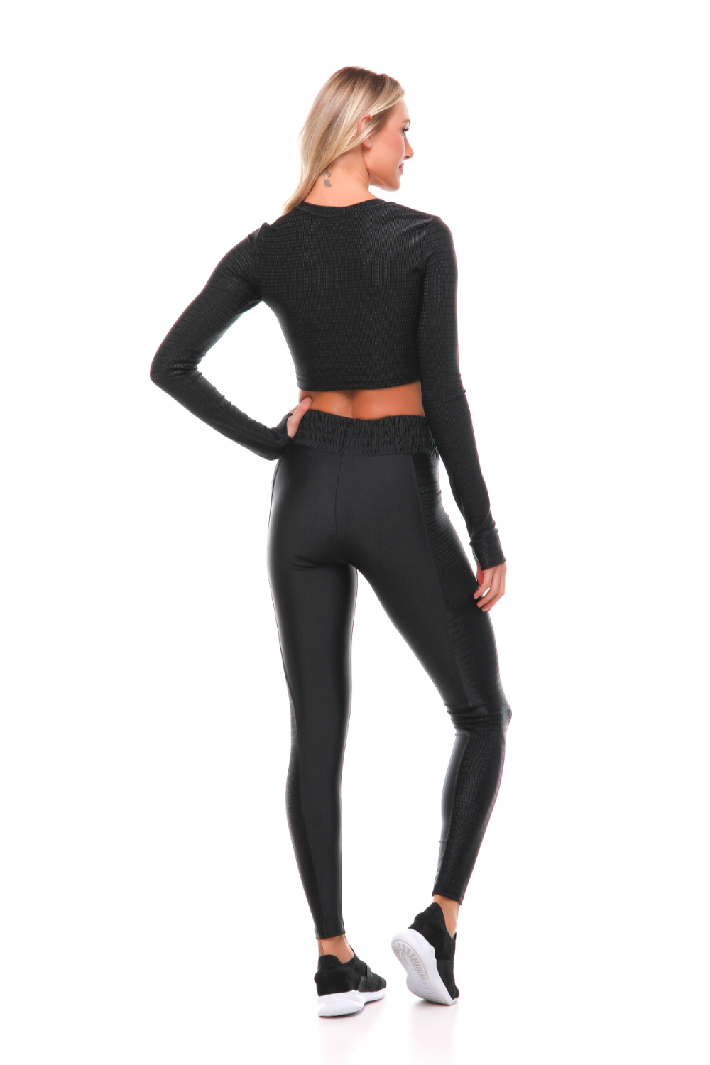 Fearless Black Long Sleeve Crop Top featuring a sleek design and textured patterns, perfect for workouts and outdoor training.