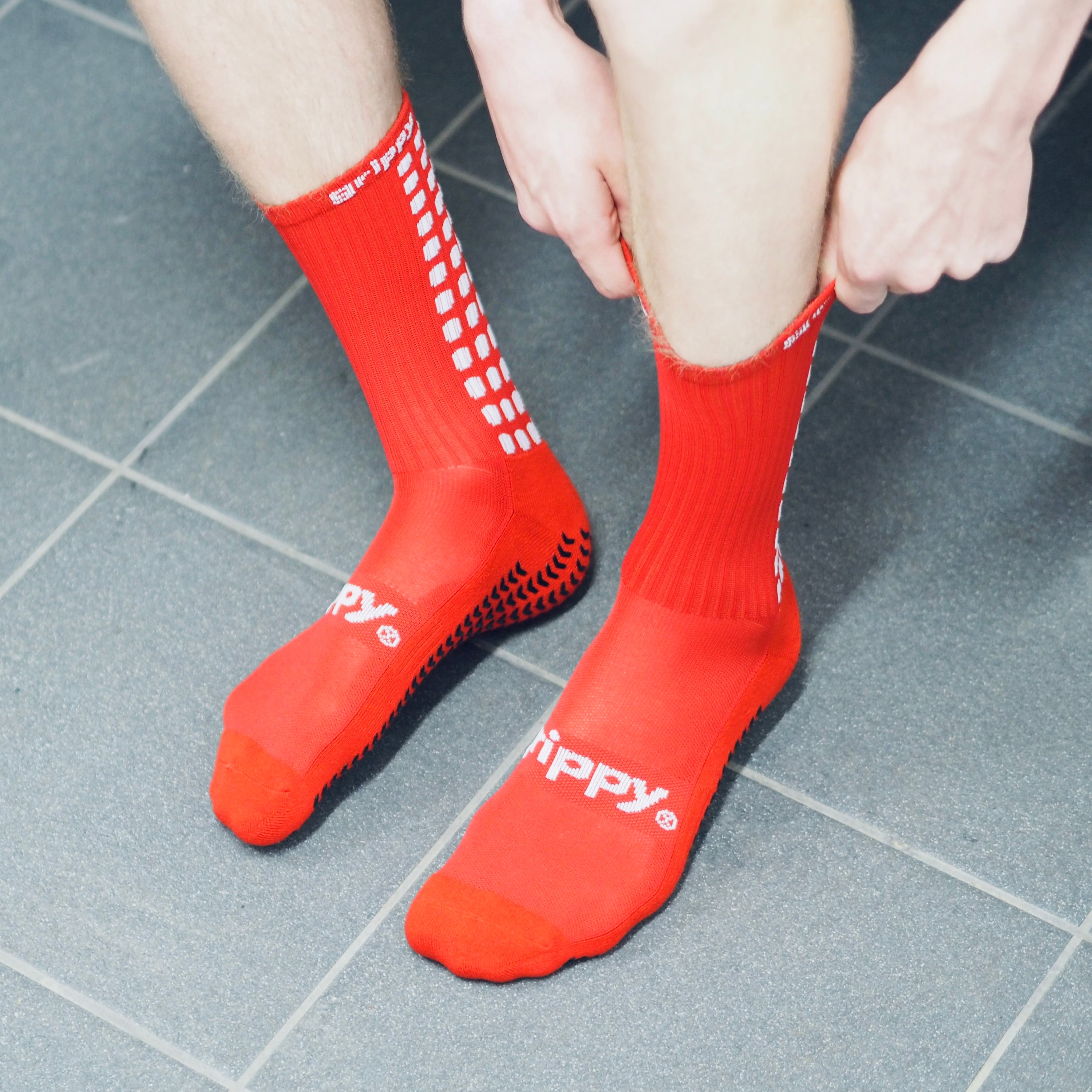 Grippy Red Football Grip Socks designed for optimal performance and comfort on the field.