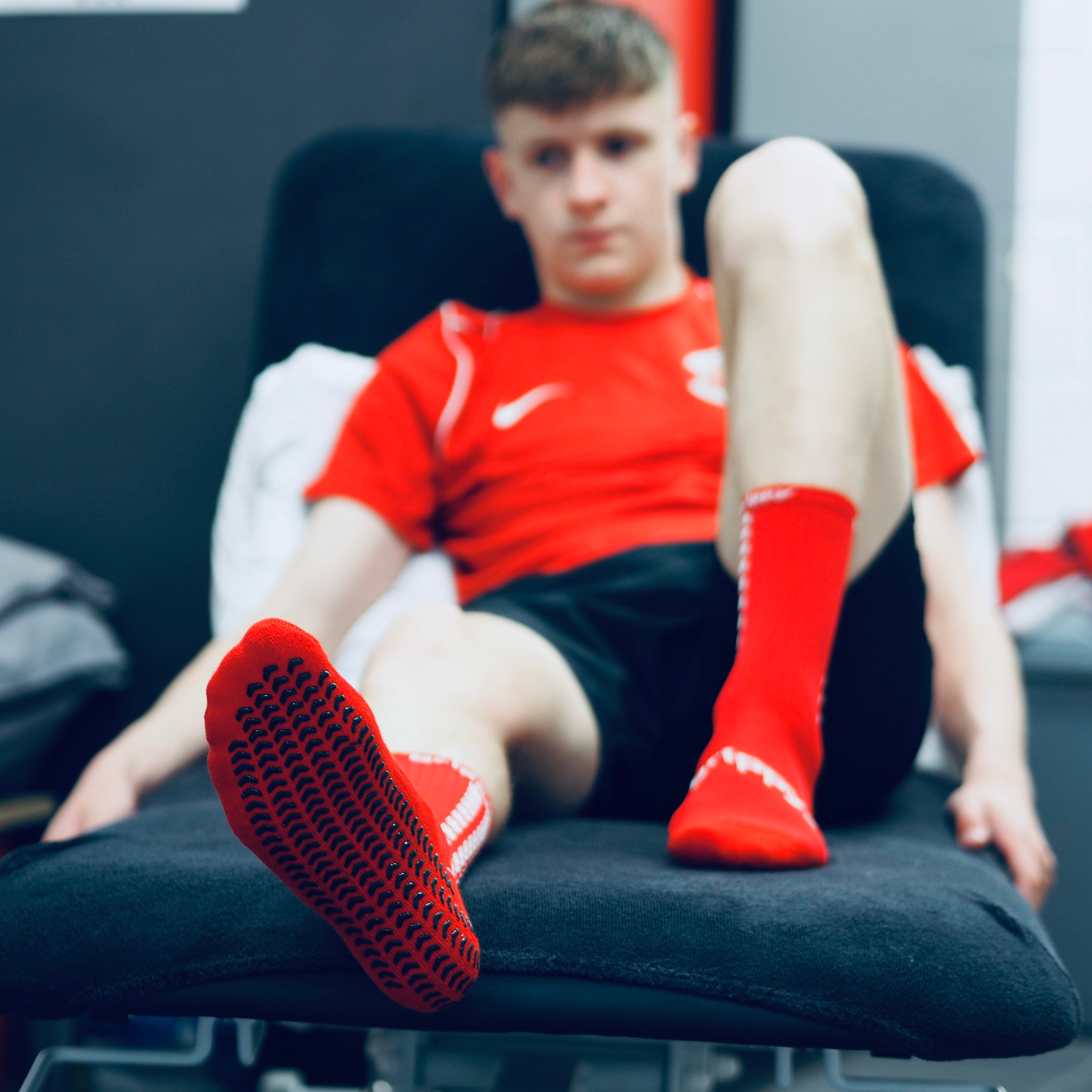 Grippy Red Football Grip Socks designed for optimal performance and comfort on the field.