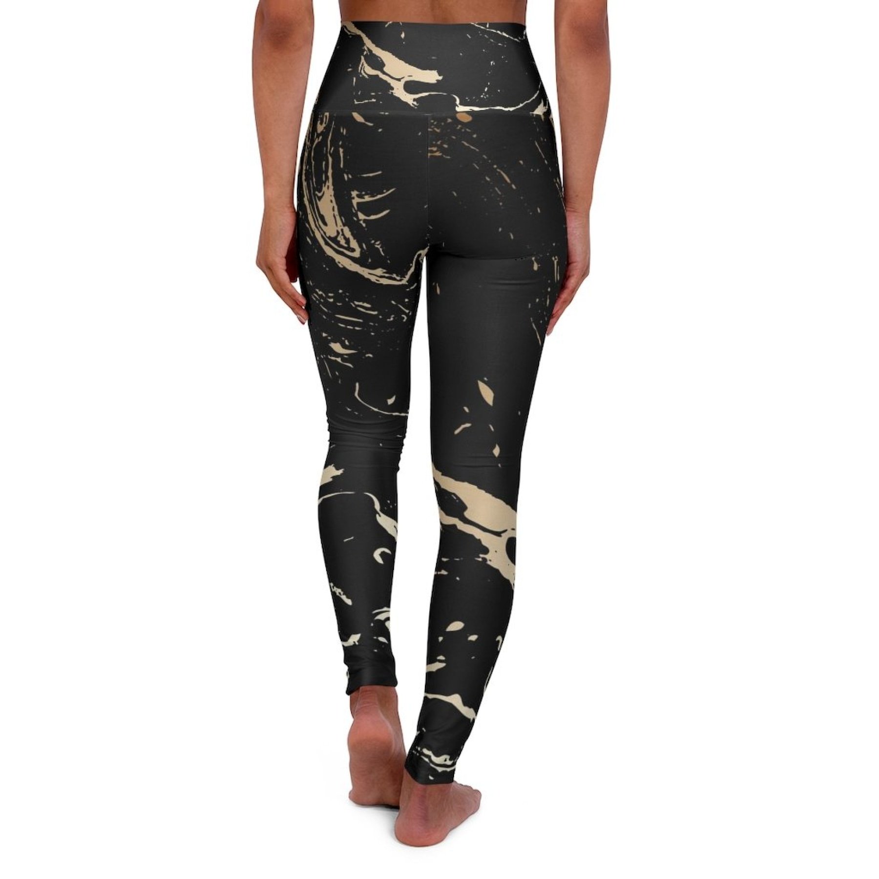 High Waisted Yoga Pants in Black and Gold Swirl, showcasing a stylish design and high waistband for comfort and support.