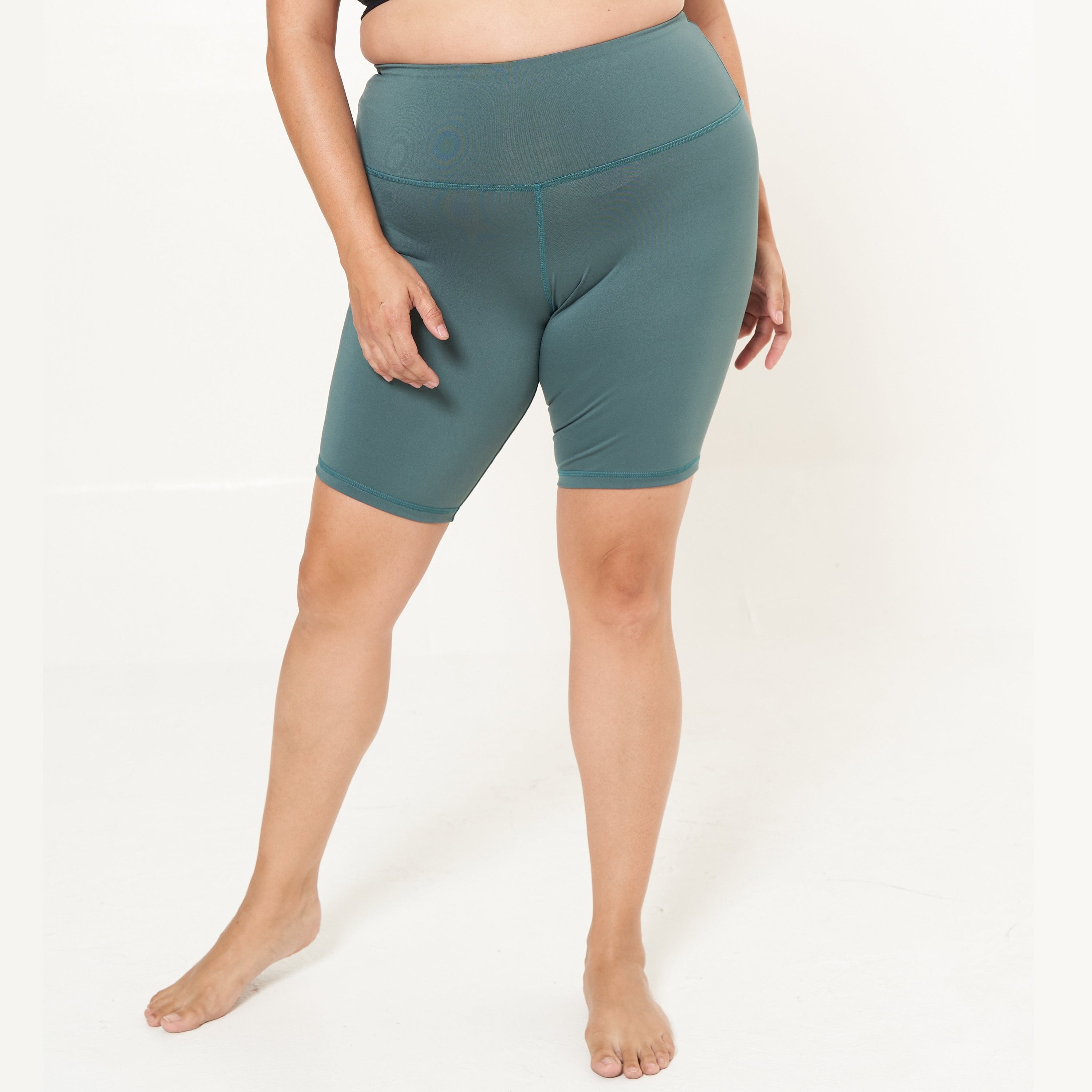 Hi-Rise Biker Short in Agave, featuring a wide waistband and convenient pocket, perfect for active lifestyles.