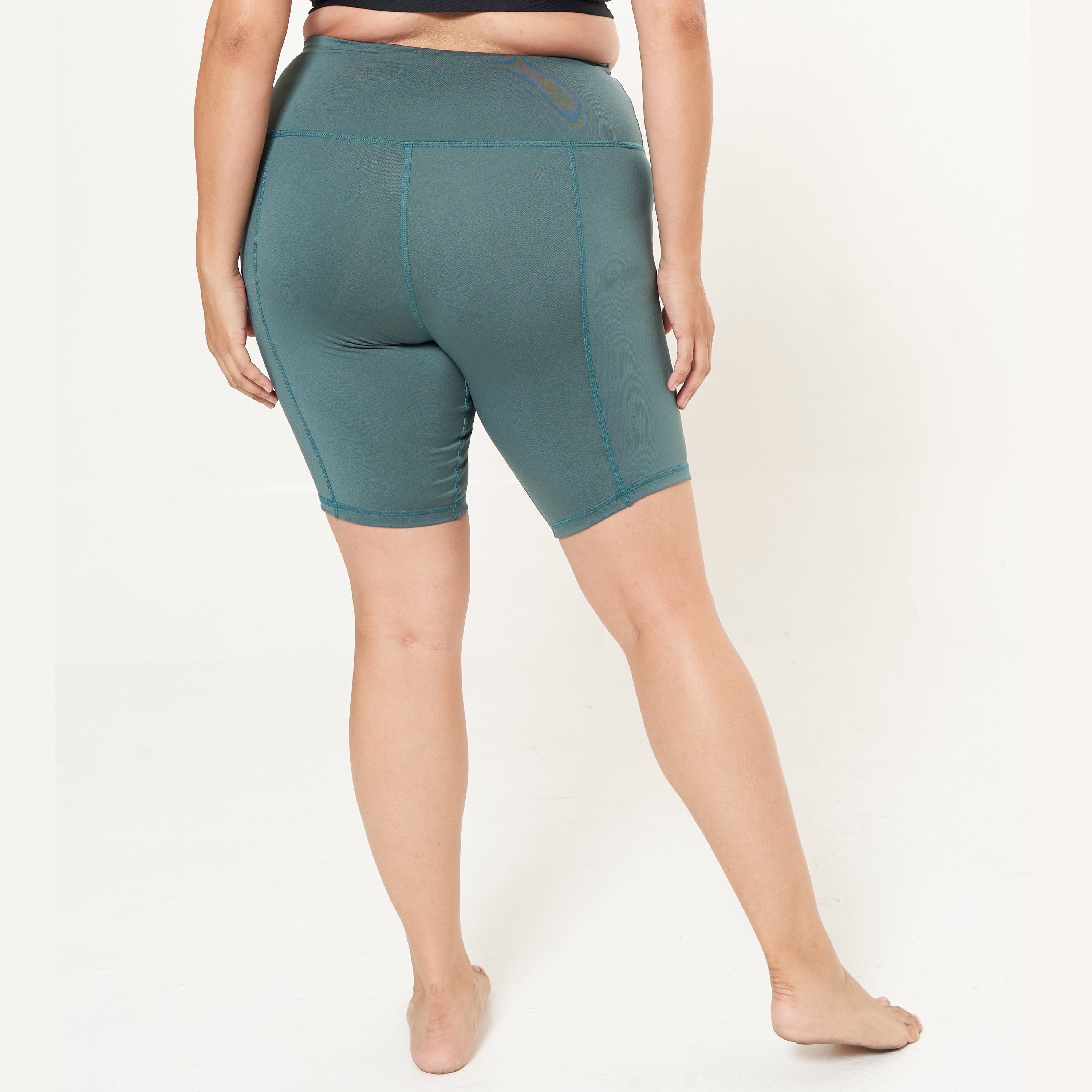 Hi-Rise Biker Short in Agave, featuring a wide waistband and convenient pocket, perfect for active lifestyles.