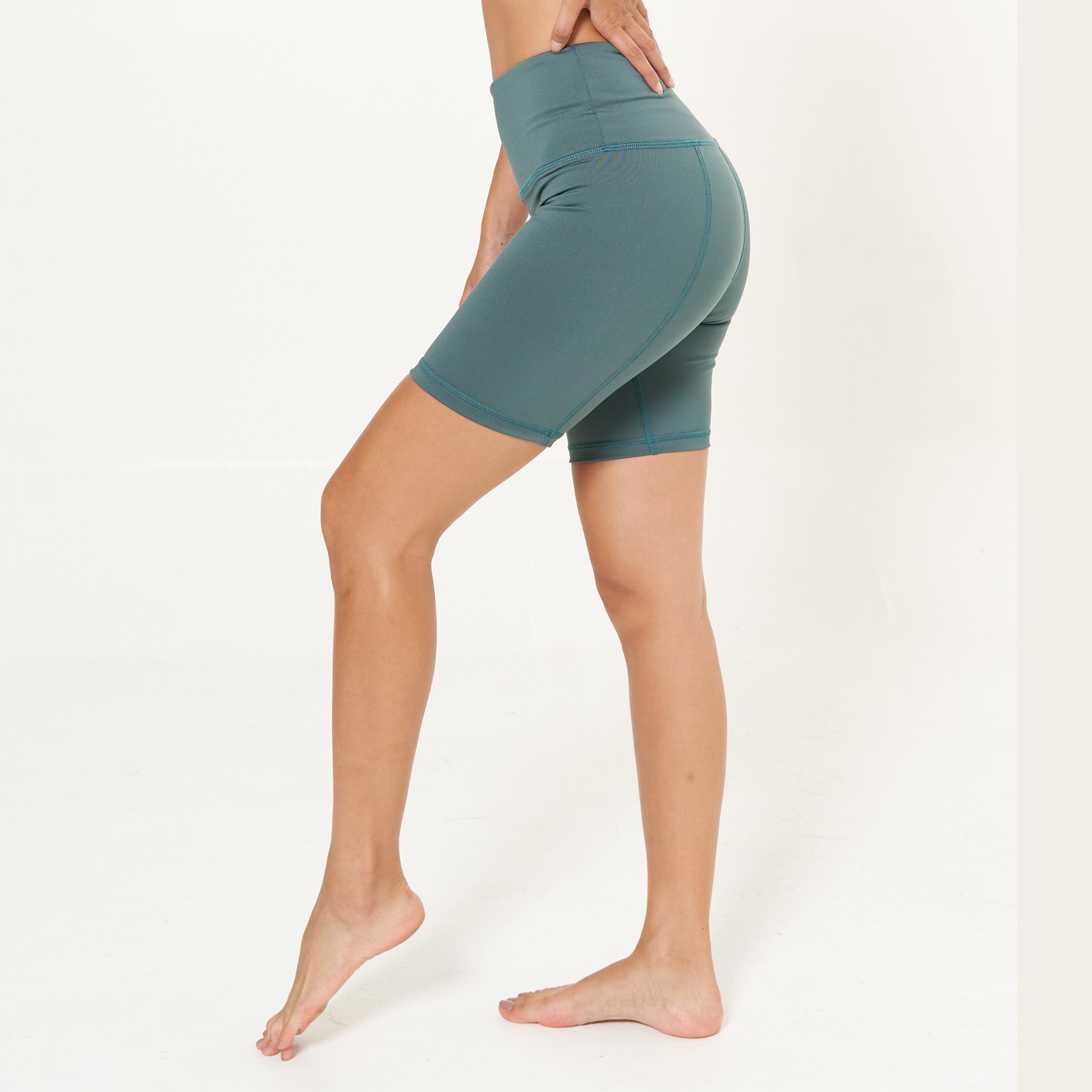 Hi-Rise Biker Short in Agave, featuring a wide waistband and convenient pocket, perfect for active lifestyles.