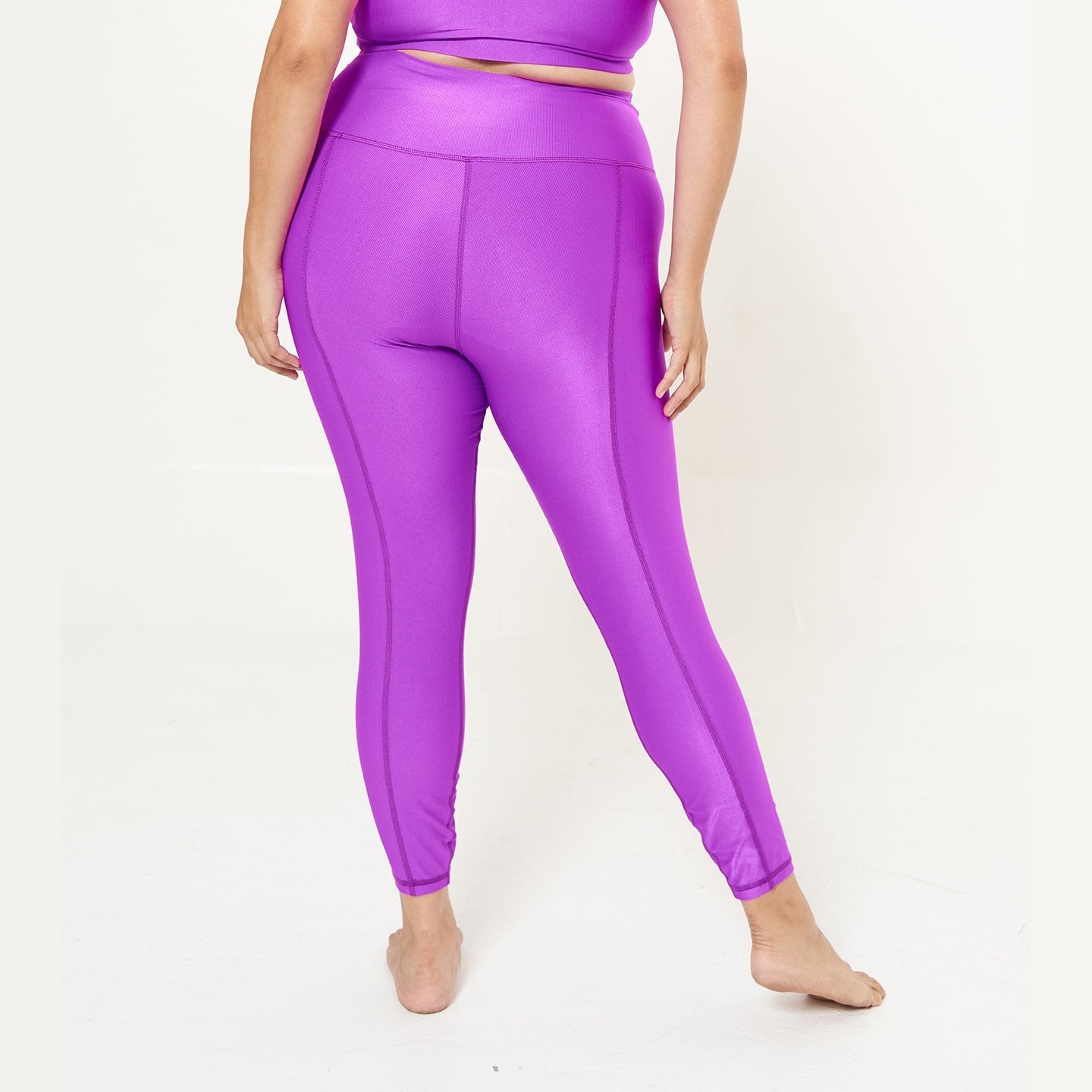 Hi-Rise Leggings in vibrant fuchsia rib pattern, showcasing a stylish and comfortable design for activewear.