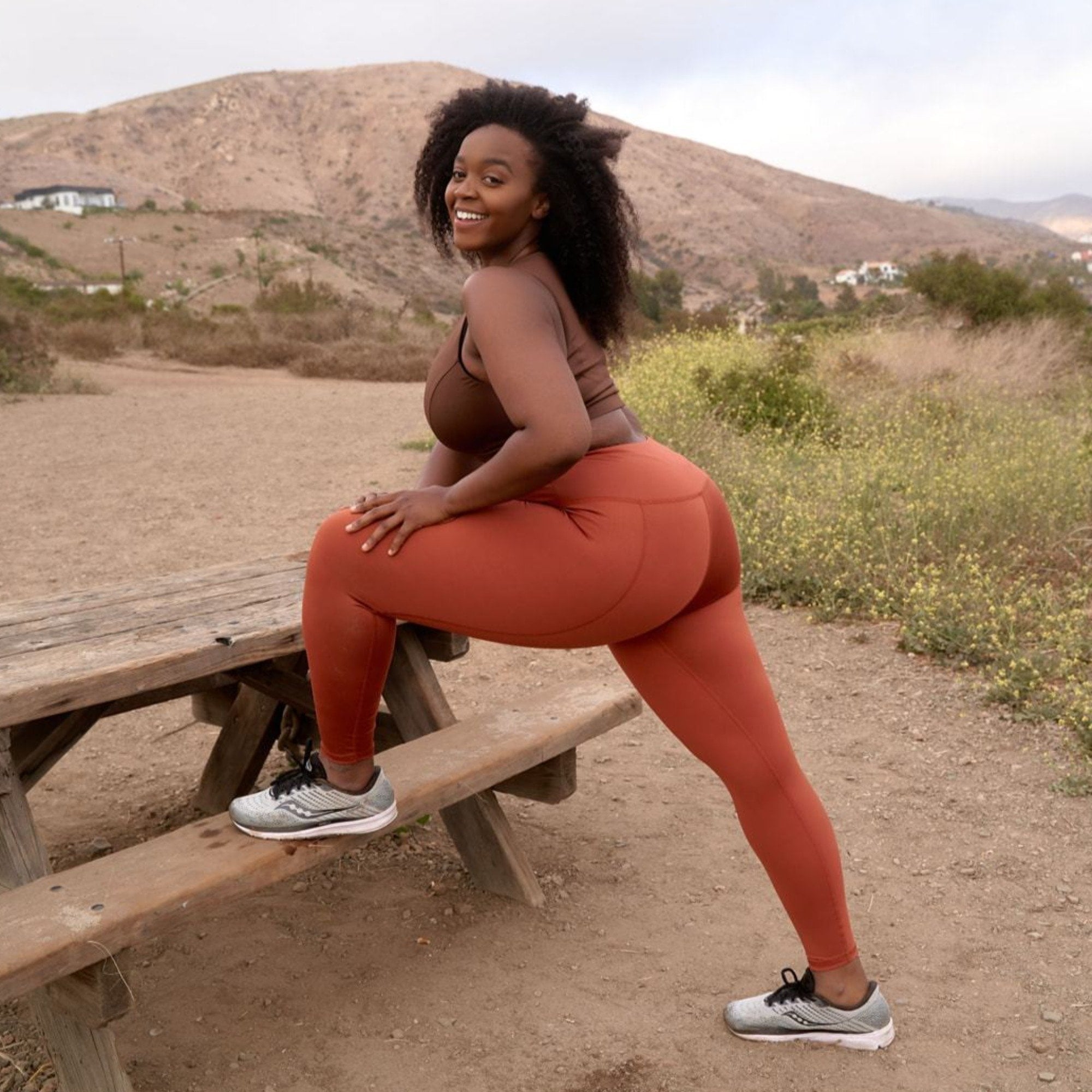 Hi-Rise Leggings in vibrant persimmon solid color, showcasing a high-rise design for comfort and support.