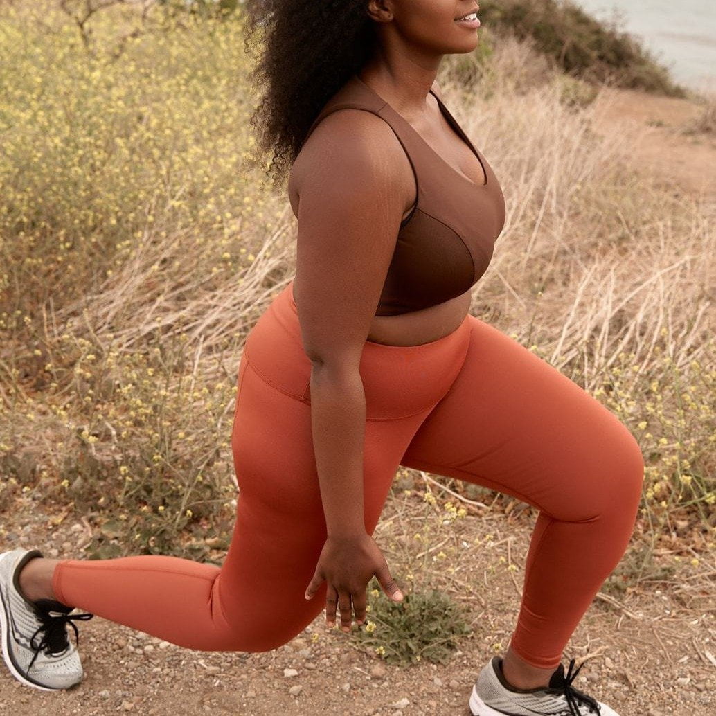 Hi-Rise Leggings in vibrant persimmon solid color, showcasing a high-rise design for comfort and support.