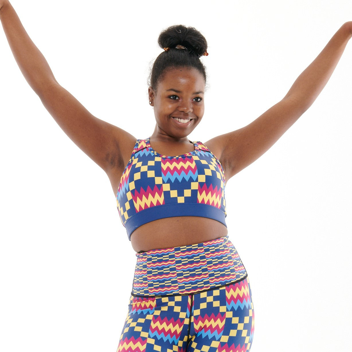 Kayentee Cerulean Sports Bra featuring bold Cerulean Blue with accents of Cerise, Black, and Yellow, designed with patterned detailing and racerback style.