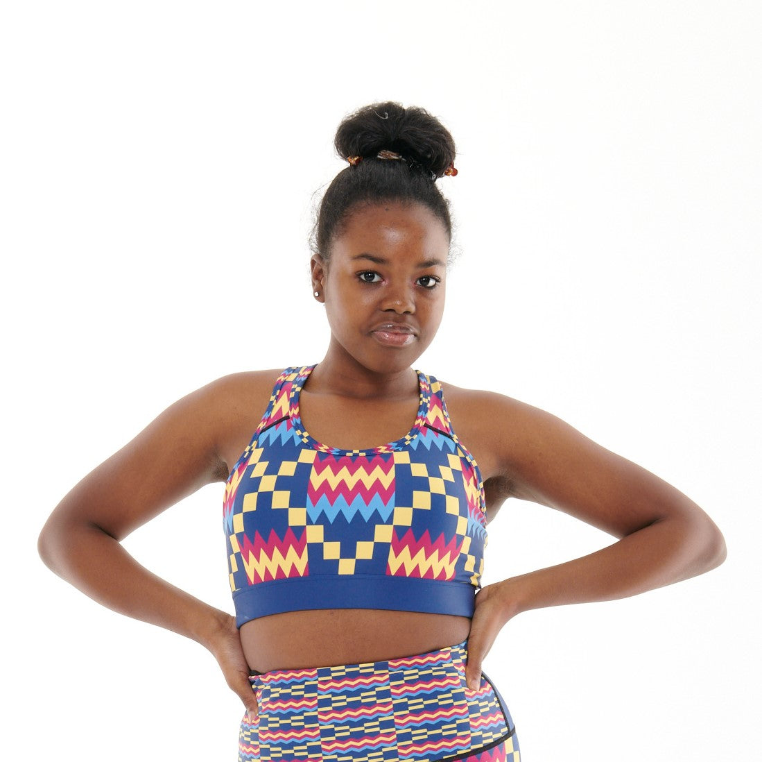 Kayentee Cerulean Sports Bra featuring bold Cerulean Blue with accents of Cerise, Black, and Yellow, designed with patterned detailing and racerback style.