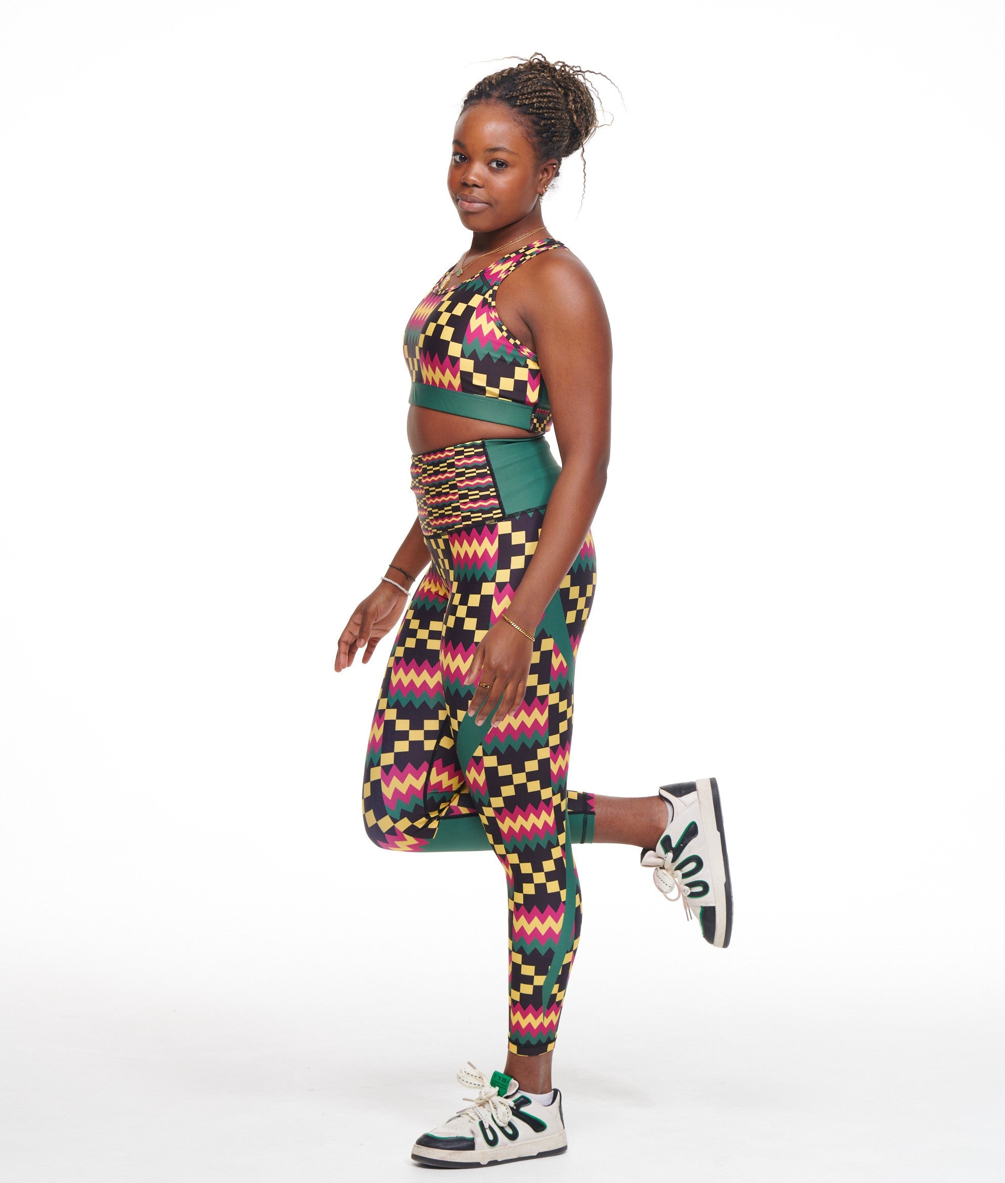 Kayentee Green Vibrant Leggings featuring bold Cerulean Blue, Cerise, Black, and Yellow geometric patterns, designed for comfort and style.