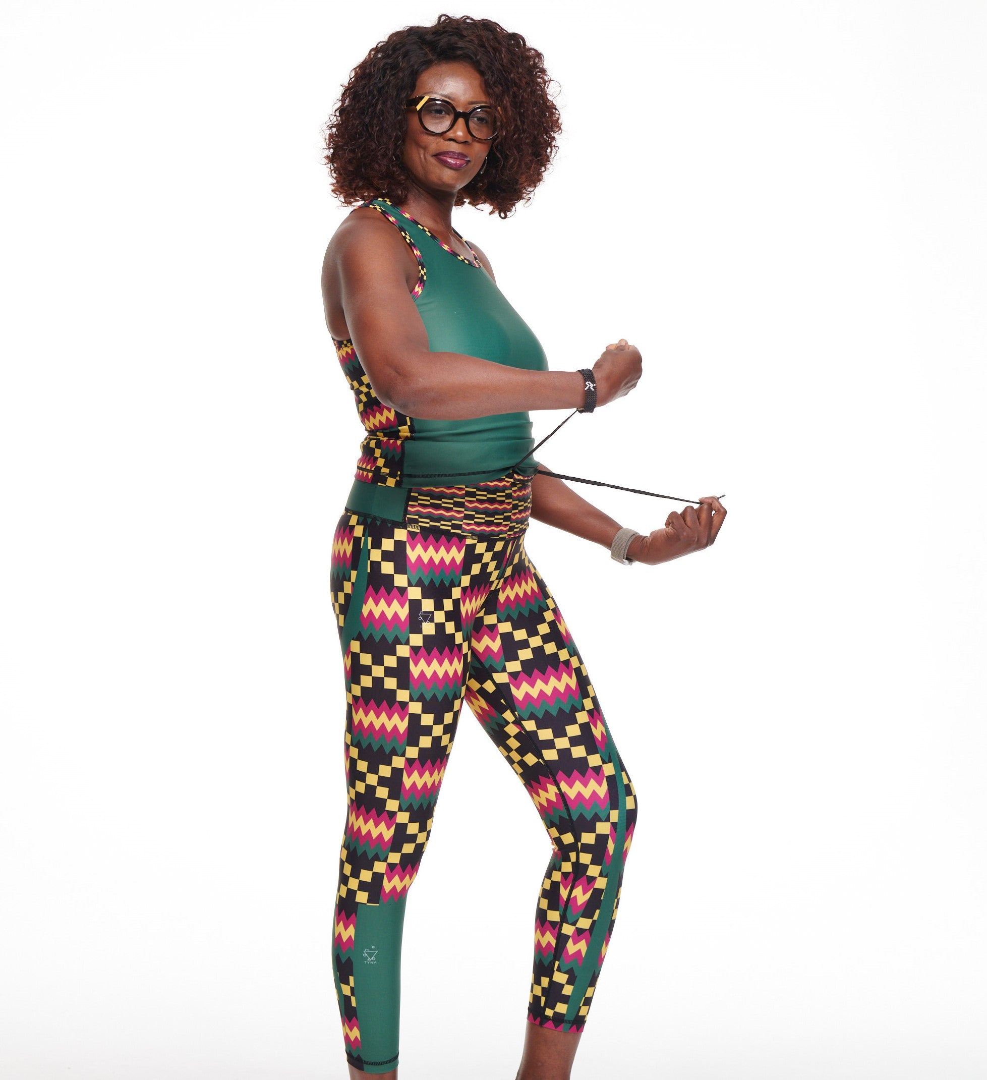 Kayentee Green Vibrant Leggings featuring bold Cerulean Blue, Cerise, Black, and Yellow geometric patterns, designed for comfort and style.