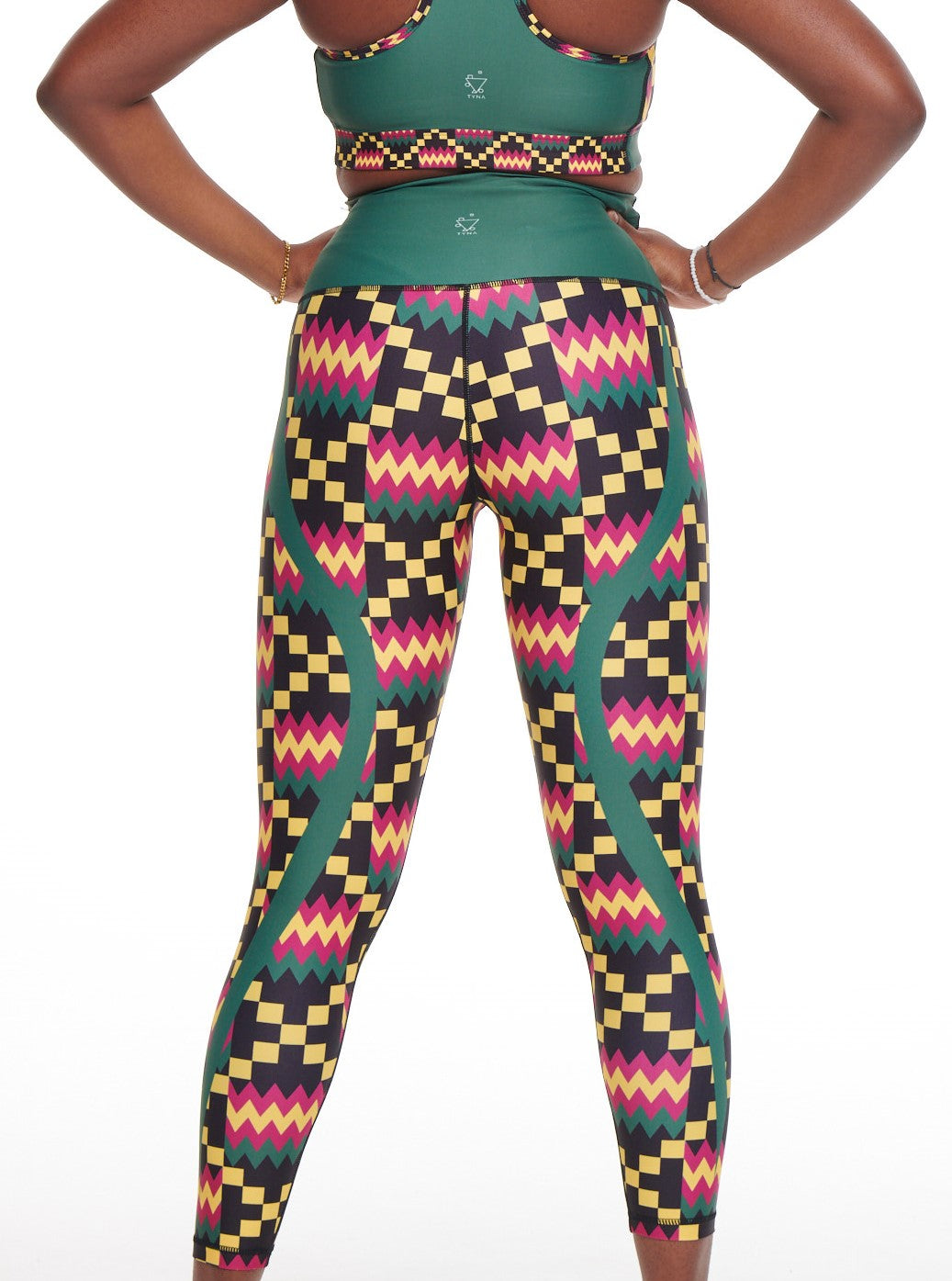 Kayentee Green Vibrant Leggings featuring bold Cerulean Blue, Cerise, Black, and Yellow geometric patterns, designed for comfort and style.