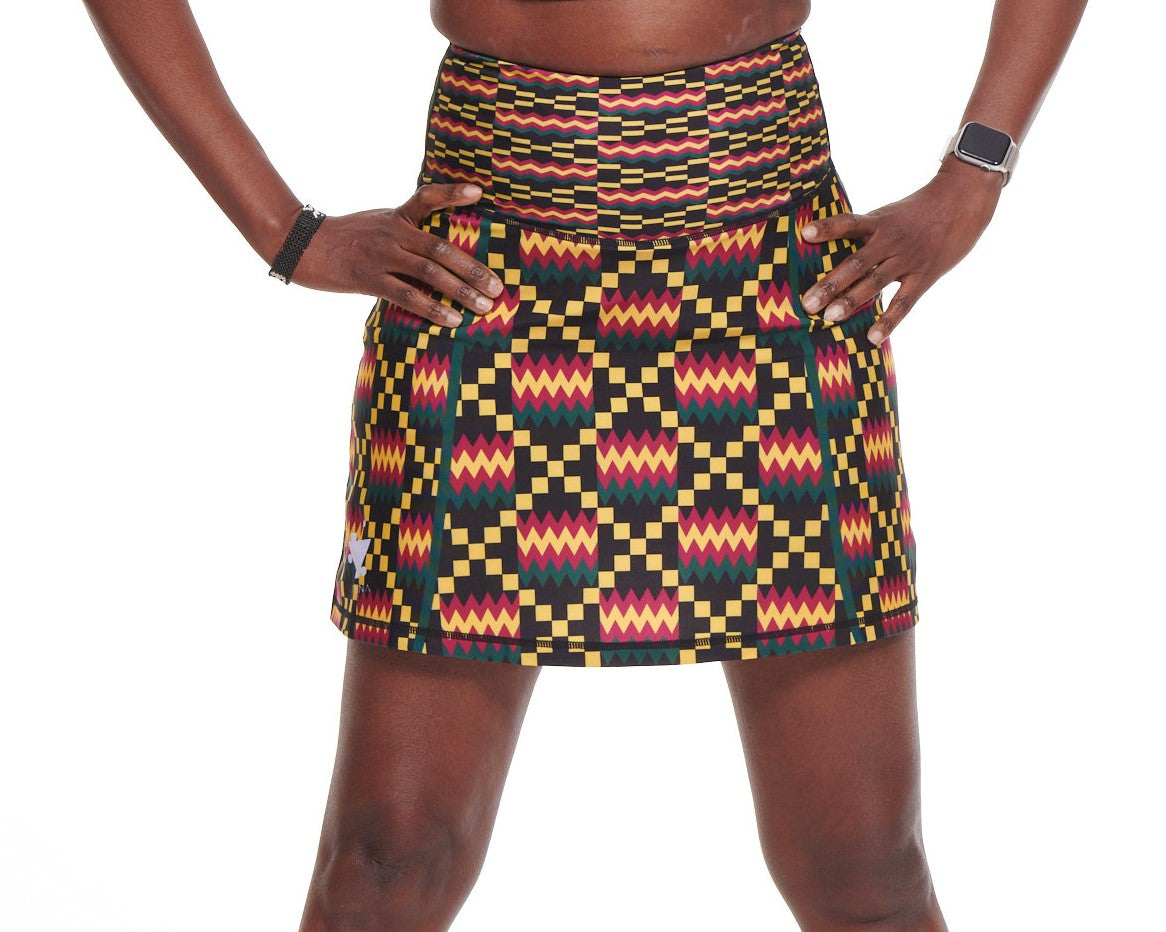 Kayentee High Rise Tennis Skort featuring vibrant Kente cloth-inspired design with compressive biker shorts underneath.