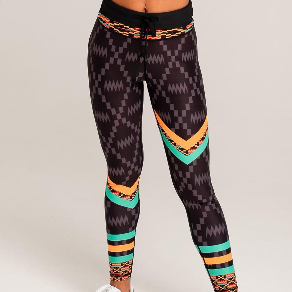 Kayentee Splash Leggings featuring vibrant geometric patterns in black, green, saffron, and flame colors, designed for comfort and style.