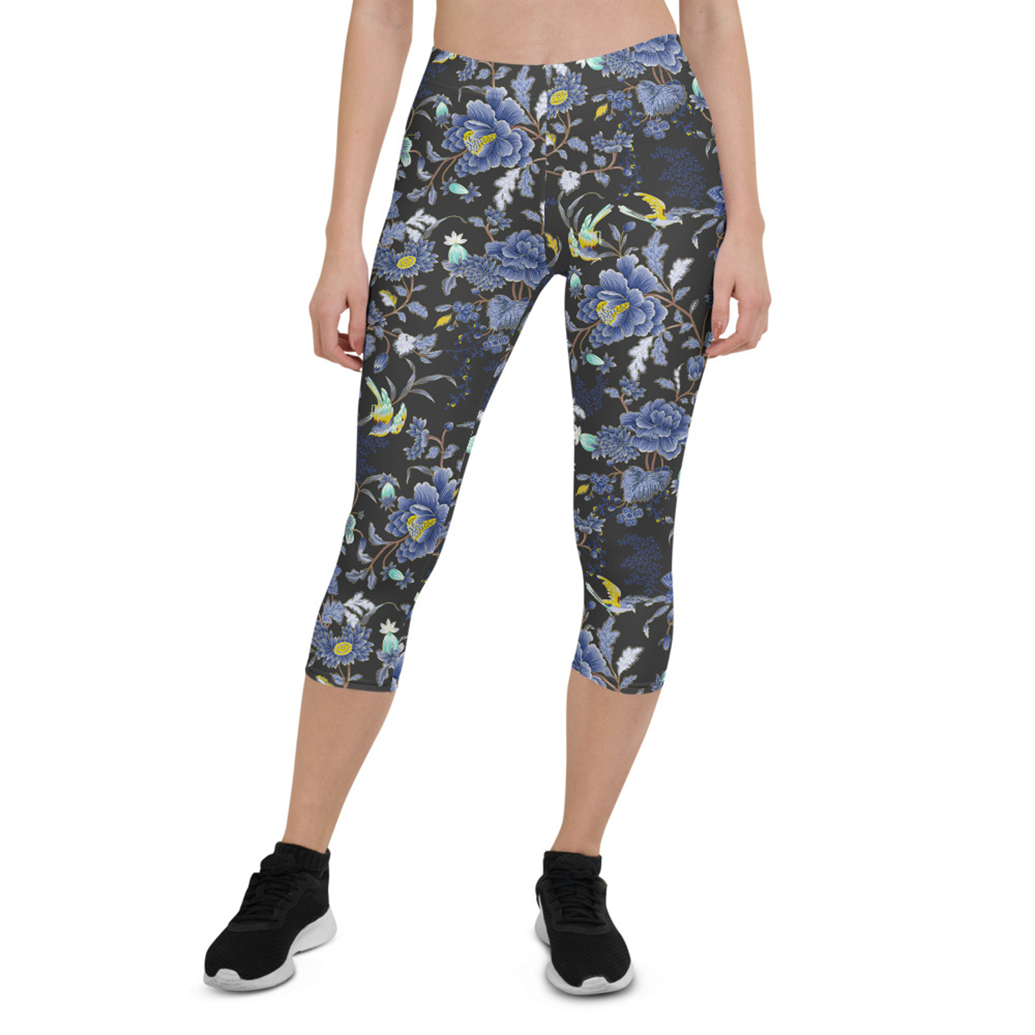 A pair of women's capri leggings featuring an oriental floral design on a dark gray background, showcasing vibrant colors and a stylish fit.