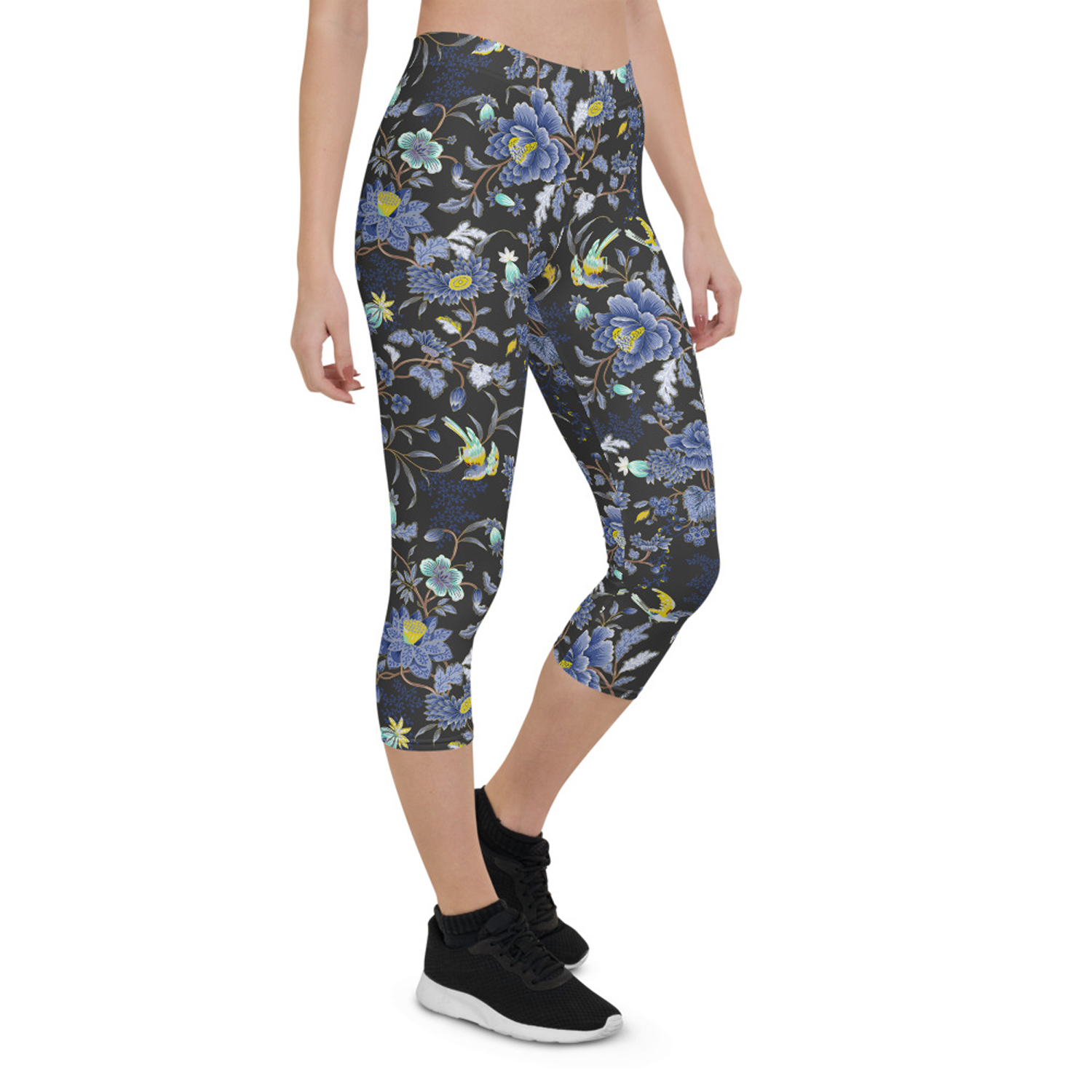 A pair of women's capri leggings featuring an oriental floral design on a dark gray background, showcasing vibrant colors and a stylish fit.