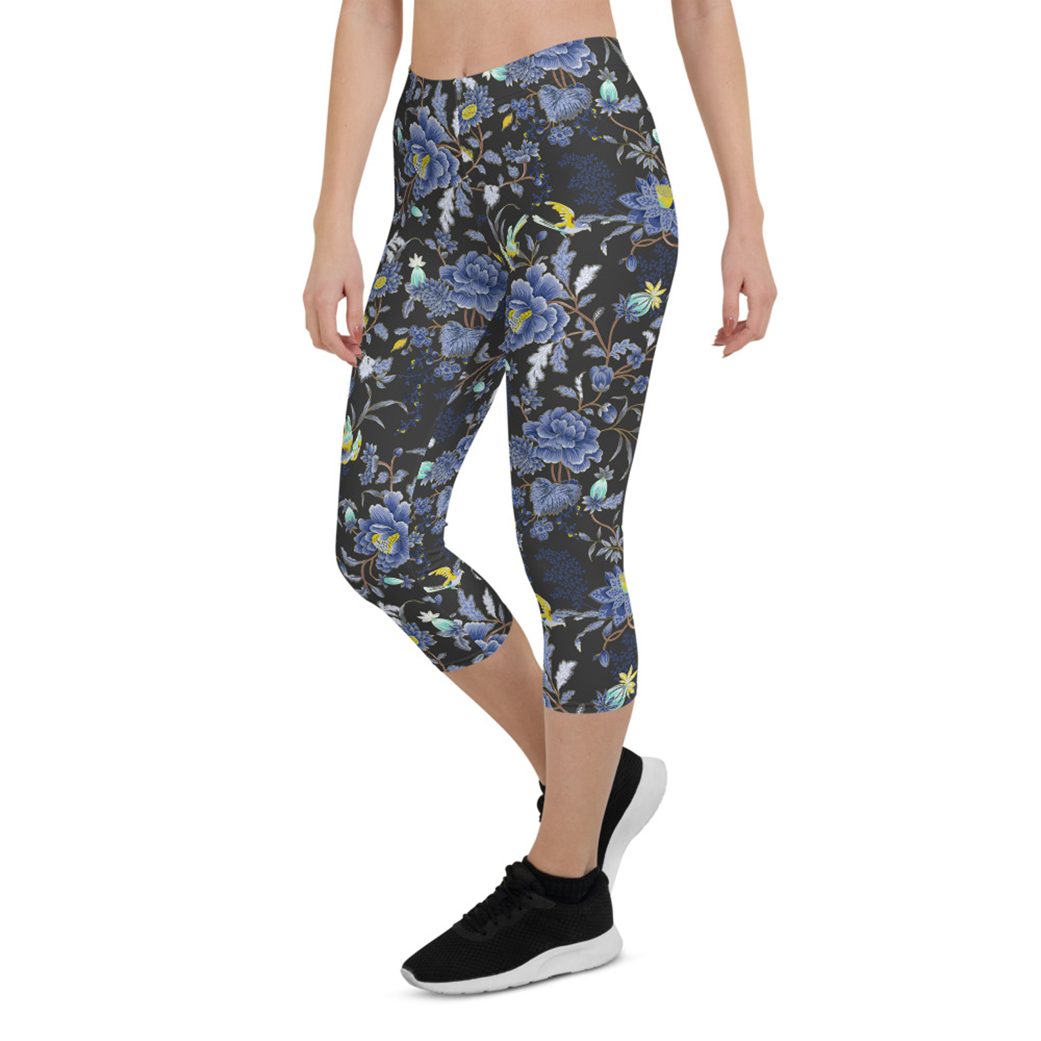 A pair of women's capri leggings featuring an oriental floral design on a dark gray background, showcasing vibrant colors and a stylish fit.