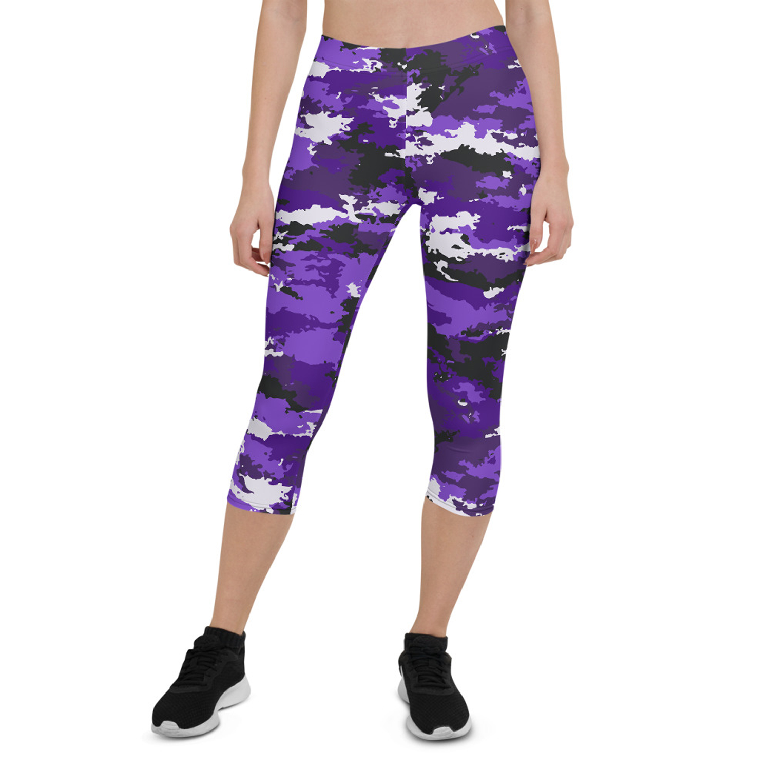 A pair of stylish Purple Camo Capri Leggings designed for women, featuring a unique camo pattern, a medium hold waistband, and a four-way stretch fabric for comfort and performance.