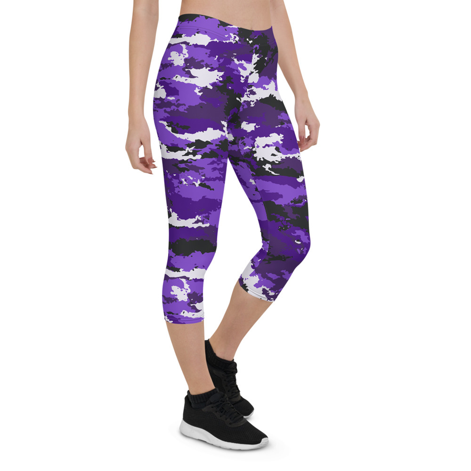 A pair of stylish Purple Camo Capri Leggings designed for women, featuring a unique camo pattern, a medium hold waistband, and a four-way stretch fabric for comfort and performance.