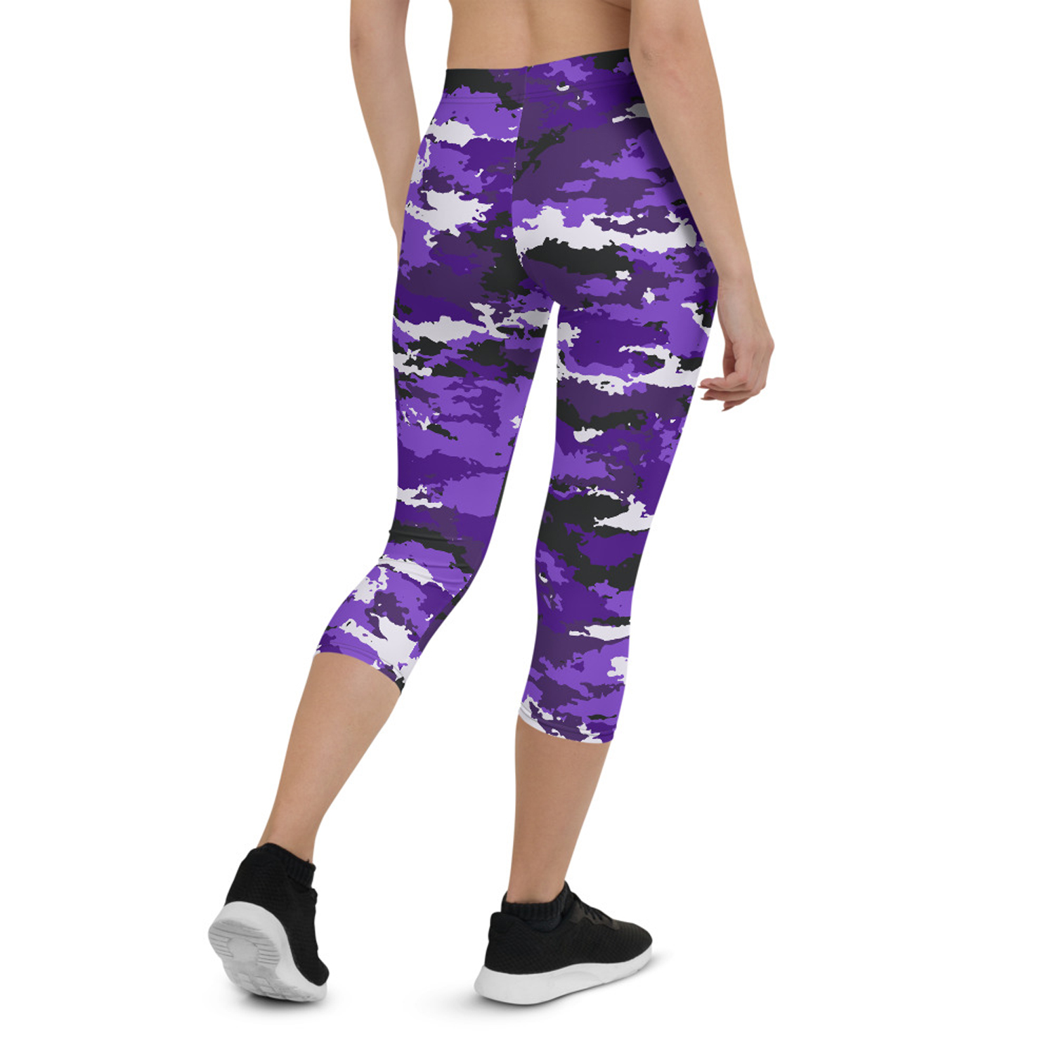 A pair of stylish Purple Camo Capri Leggings designed for women, featuring a unique camo pattern, a medium hold waistband, and a four-way stretch fabric for comfort and performance.