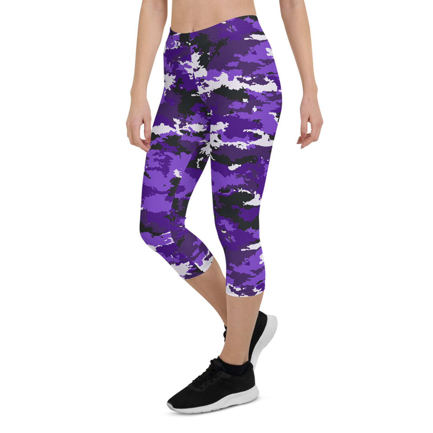 A pair of stylish Purple Camo Capri Leggings designed for women, featuring a unique camo pattern, a medium hold waistband, and a four-way stretch fabric for comfort and performance.