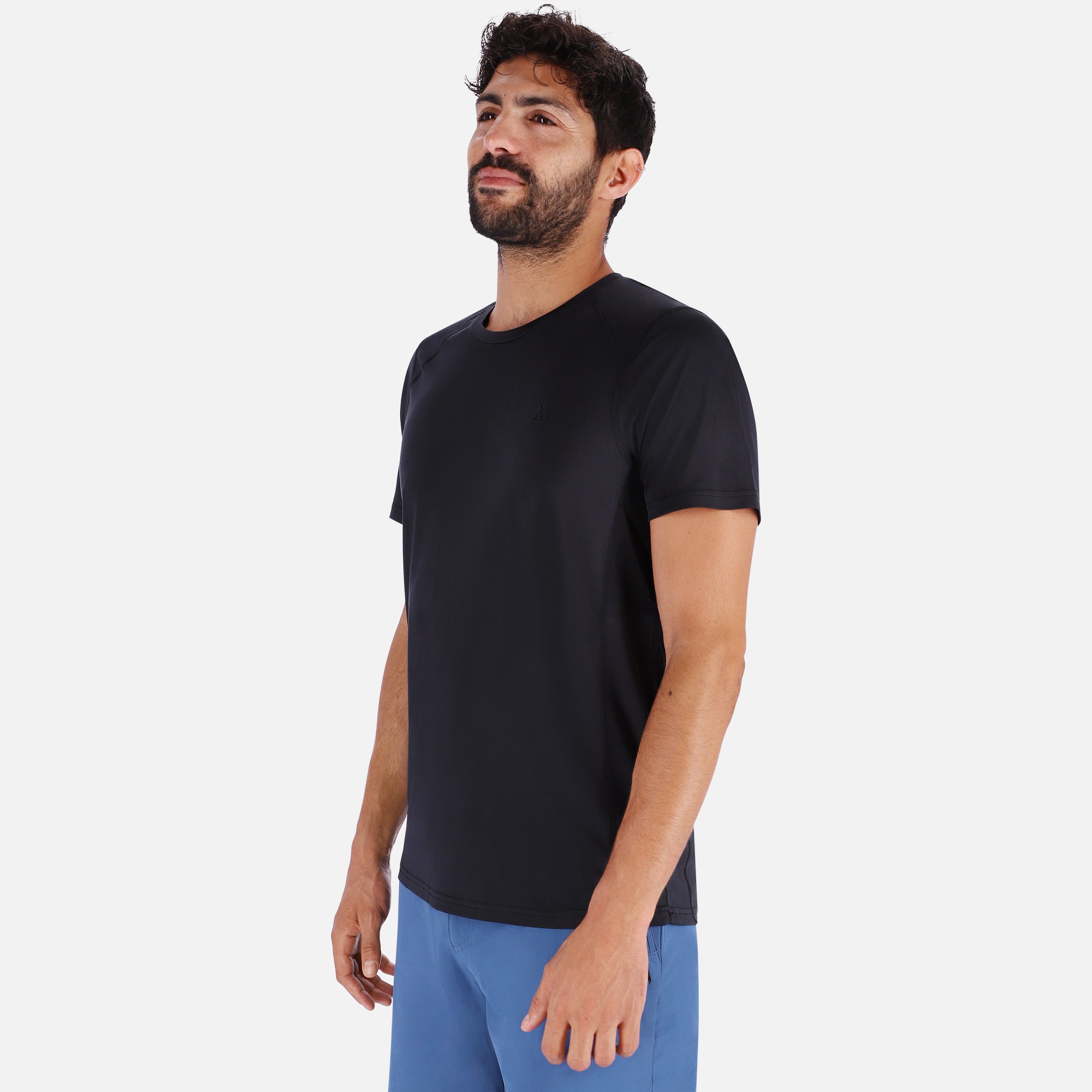 A sleek black QuickDry shirt featuring a unique ventilation system, designed for outdoor activities with moisture-wicking technology.