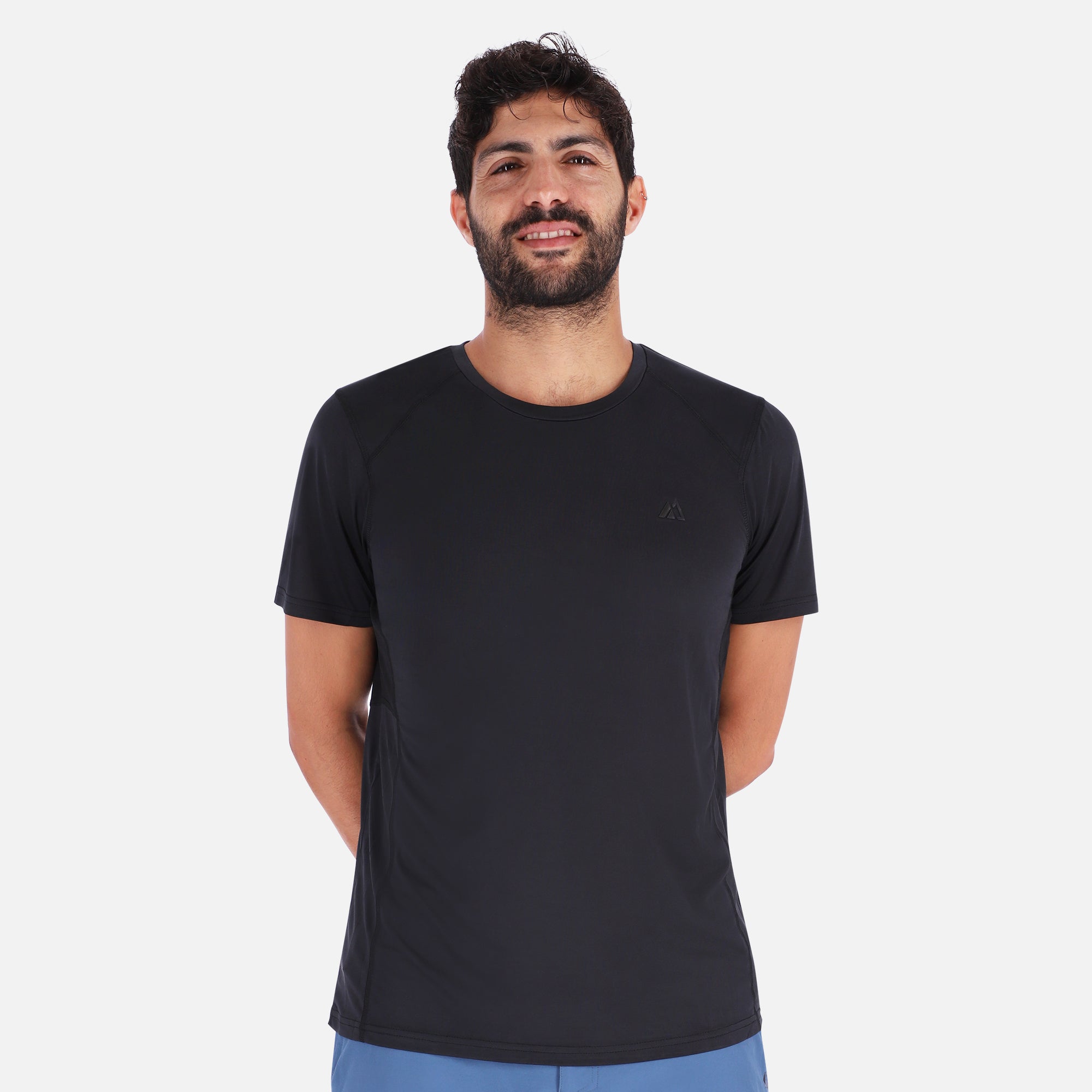 A sleek black QuickDry shirt featuring a unique ventilation system, designed for outdoor activities with moisture-wicking technology.