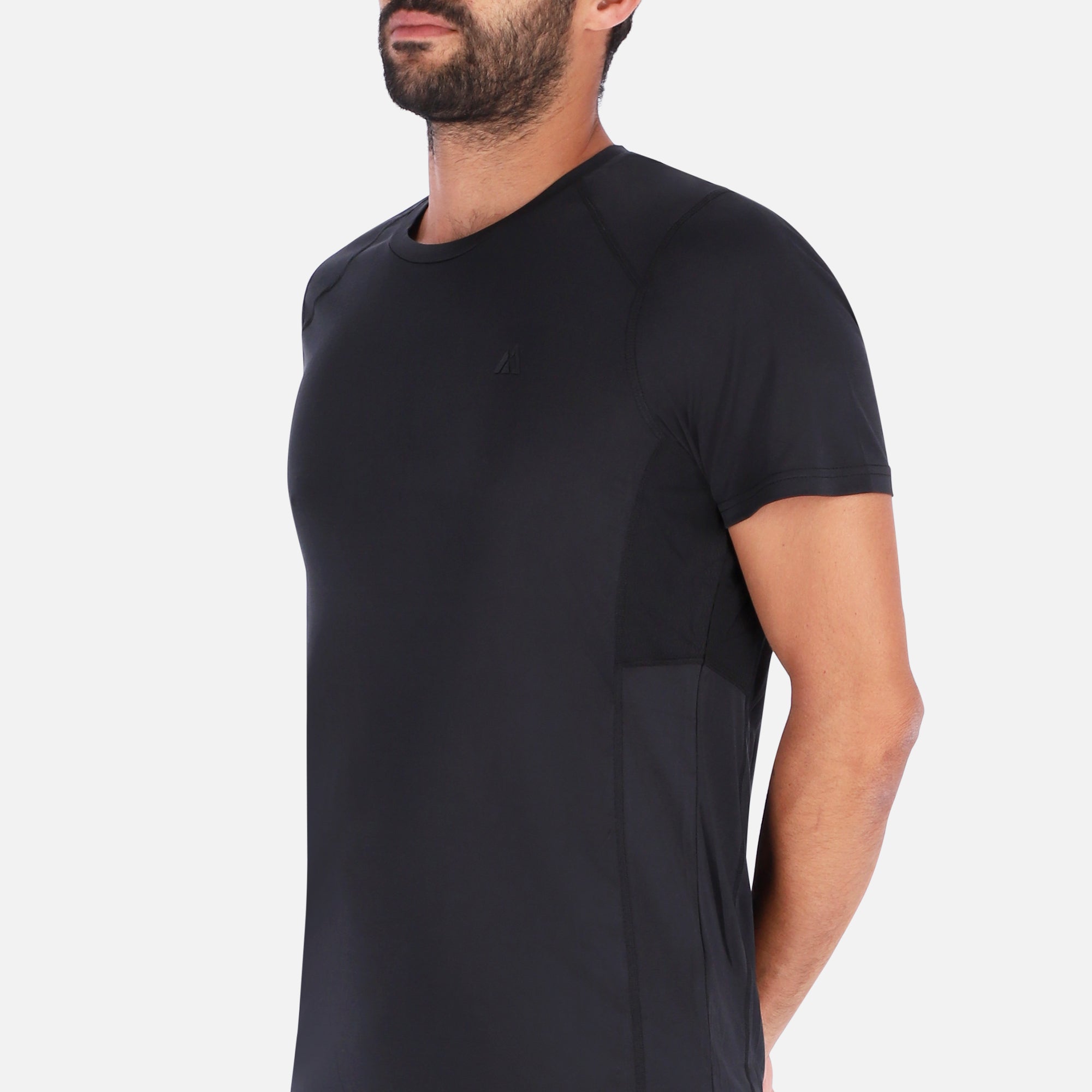 A sleek black QuickDry shirt featuring a unique ventilation system, designed for outdoor activities with moisture-wicking technology.