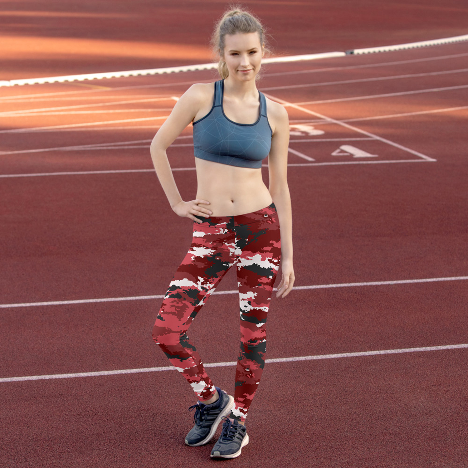 A pair of stylish red camo leggings for women, showcasing a unique graphic design, perfect for workouts and casual wear.