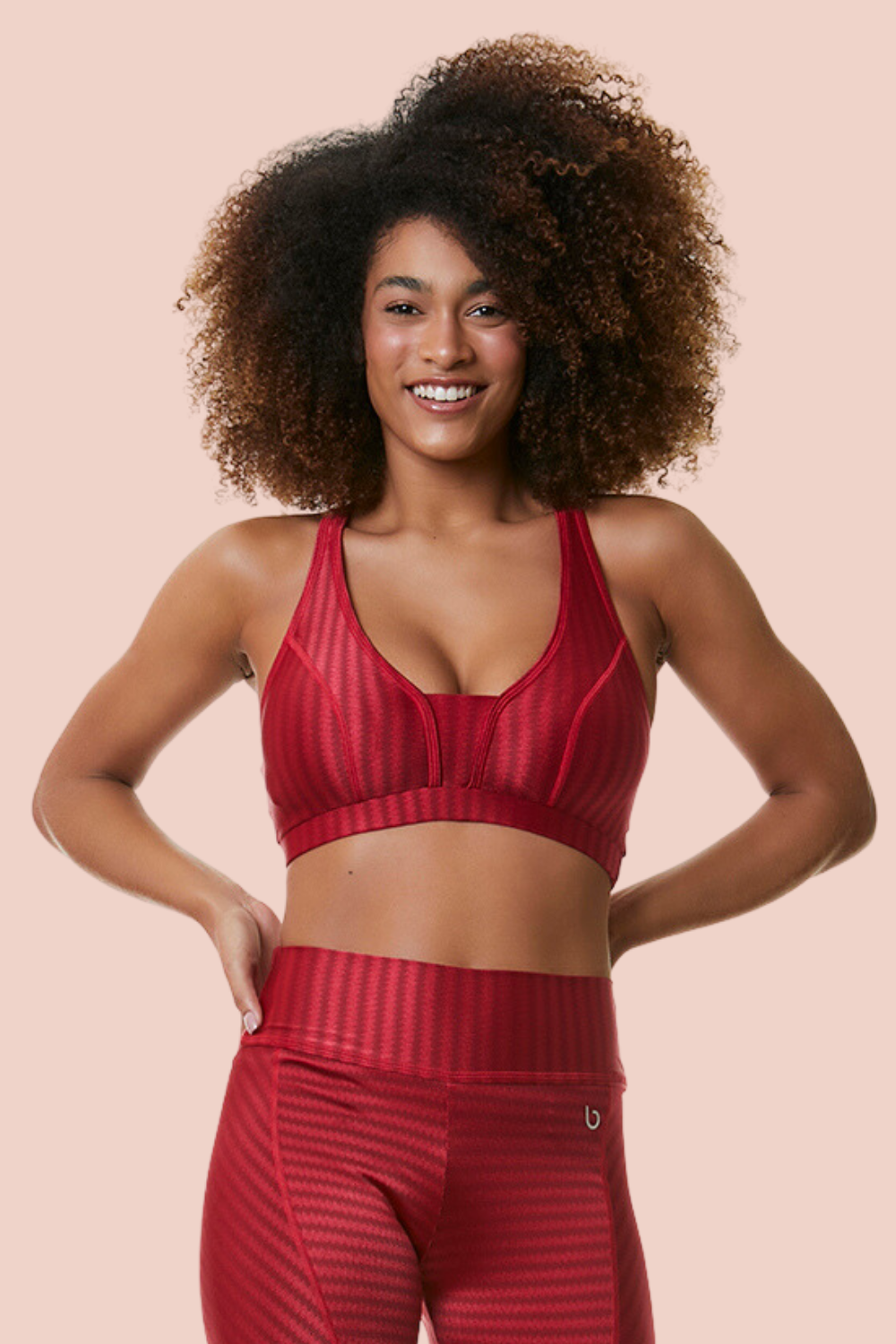 Ruby Ikat Sports Bra featuring a low scoop neck and racerback design, made from breathable Ikat fabric with cooling technology.