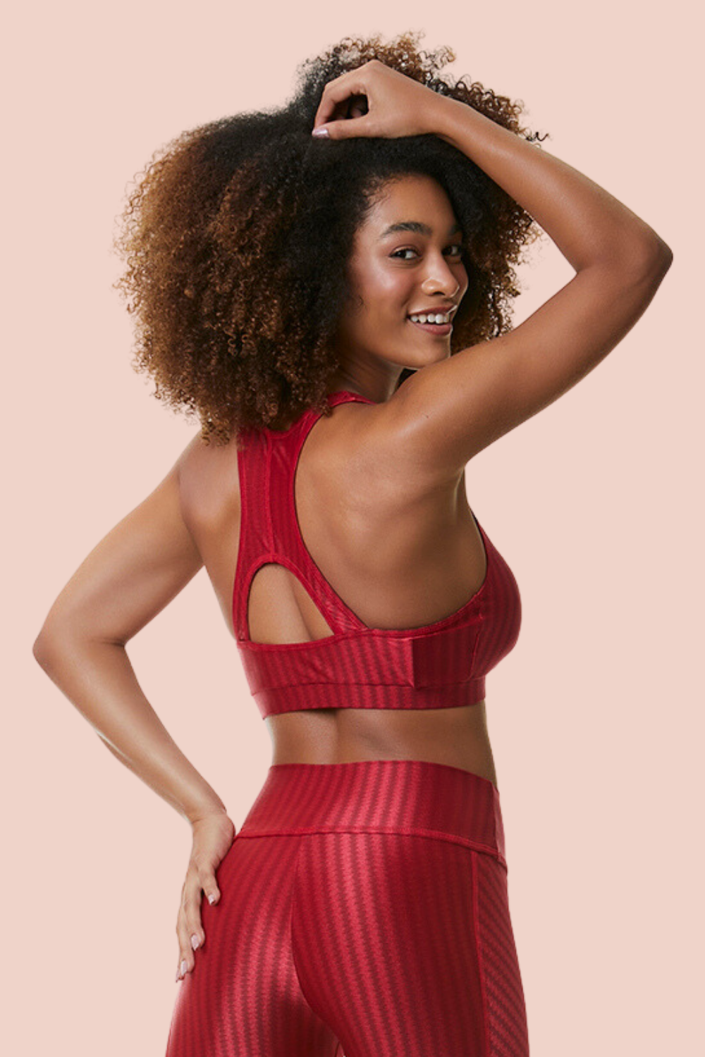 Ruby Ikat Sports Bra featuring a low scoop neck and racerback design, made from breathable Ikat fabric with cooling technology.