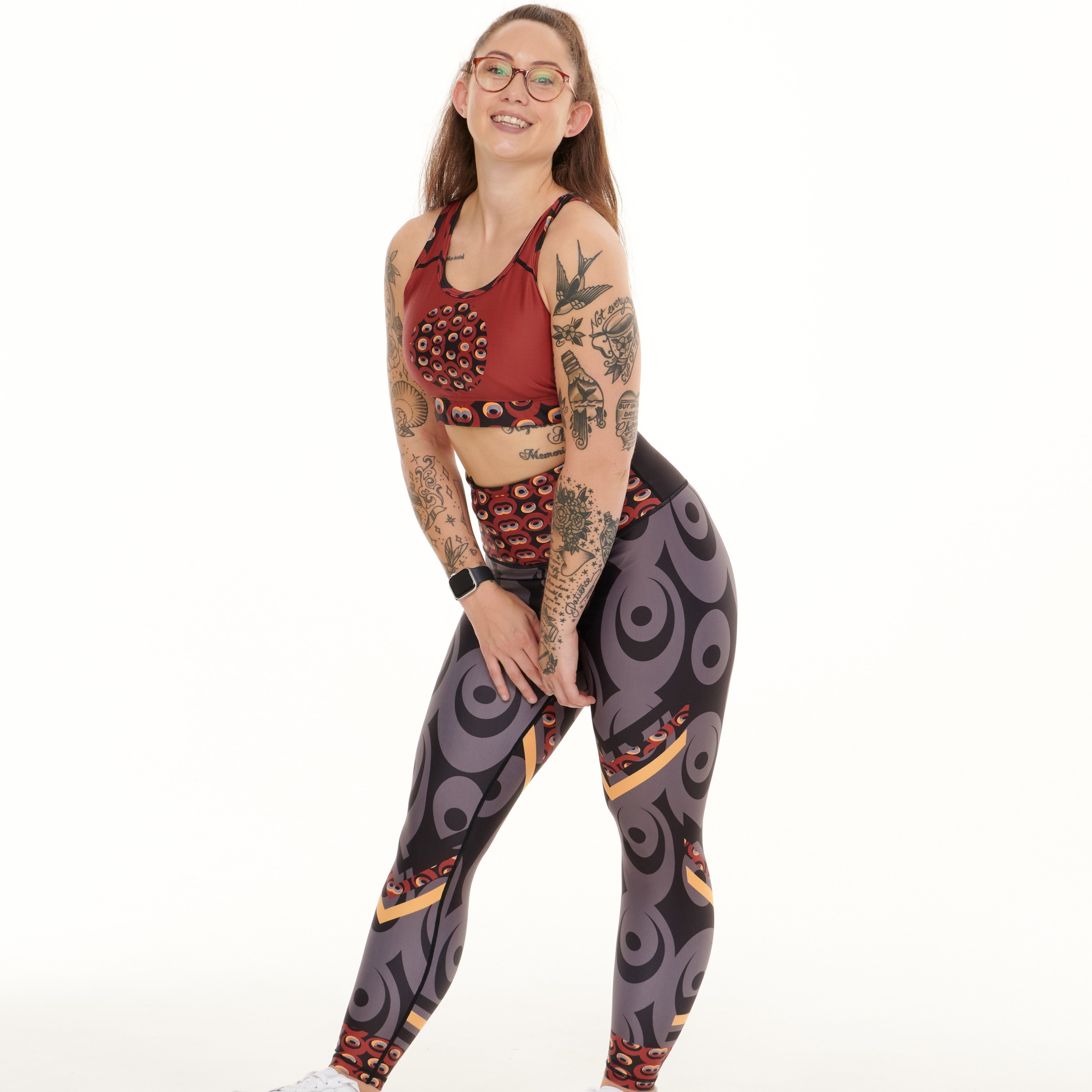 Siefay On Iron Red Splash Leggings featuring vibrant Ankara-inspired patterns in Iron Red, Orange, Black, and Grey.