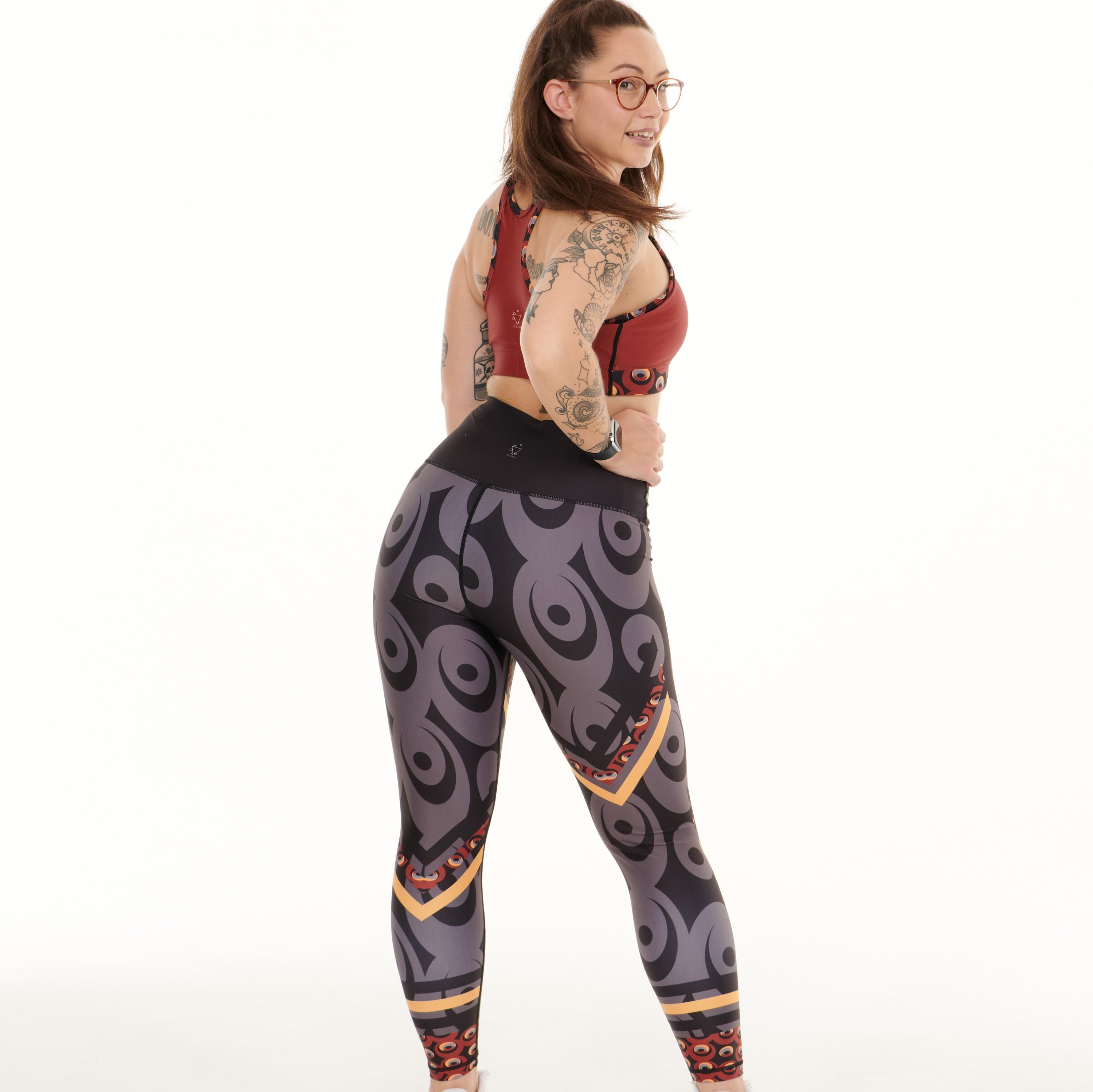 Siefay On Iron Red Splash Leggings featuring vibrant Ankara-inspired patterns in Iron Red, Orange, Black, and Grey.