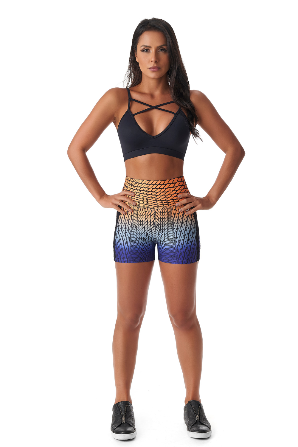 A pair of Spiral Booty Shorts featuring a vibrant abstract pattern, high-waisted design, and soft stretchy material, perfect for active wear.