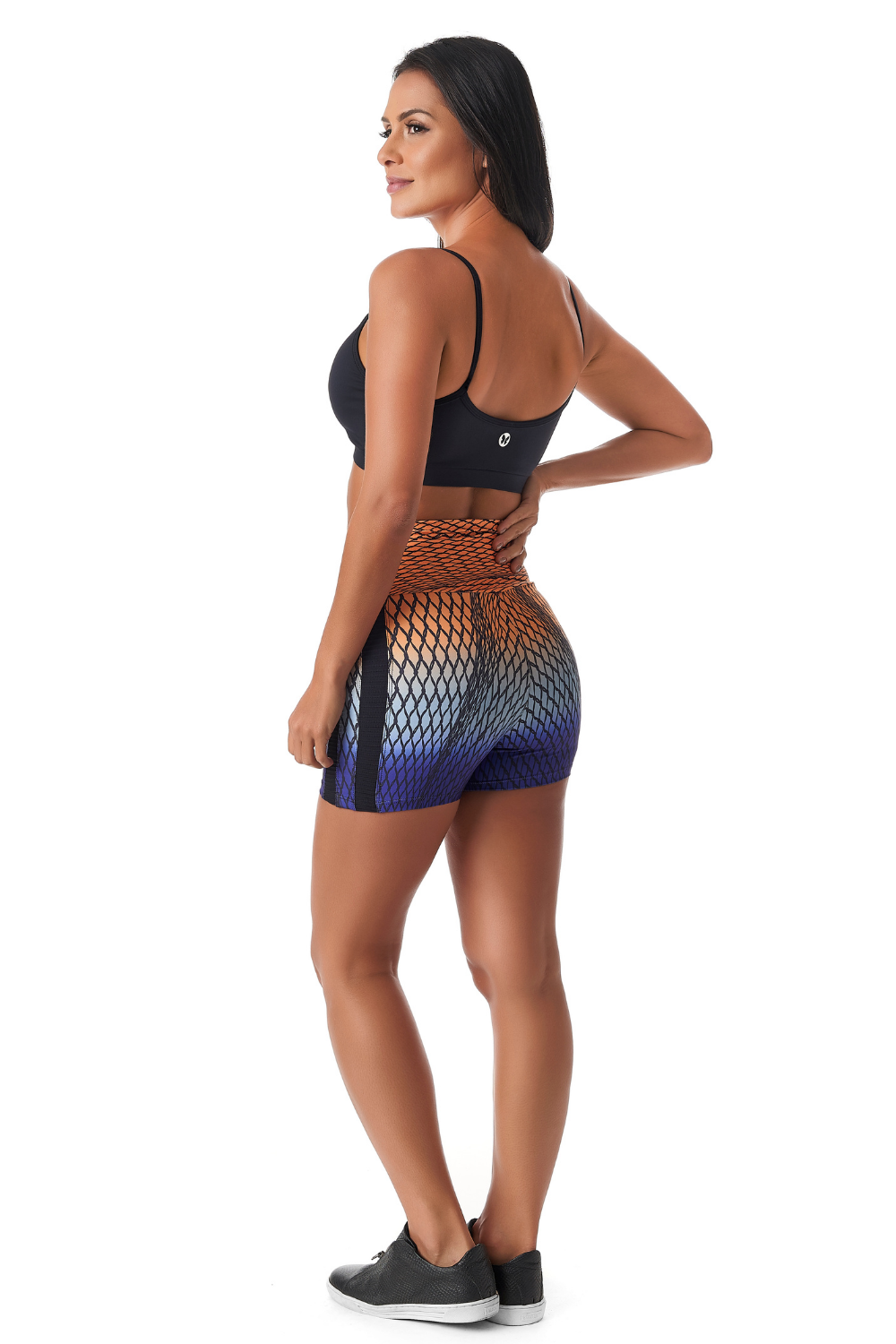 A pair of Spiral Booty Shorts featuring a vibrant abstract pattern, high-waisted design, and soft stretchy material, perfect for active wear.