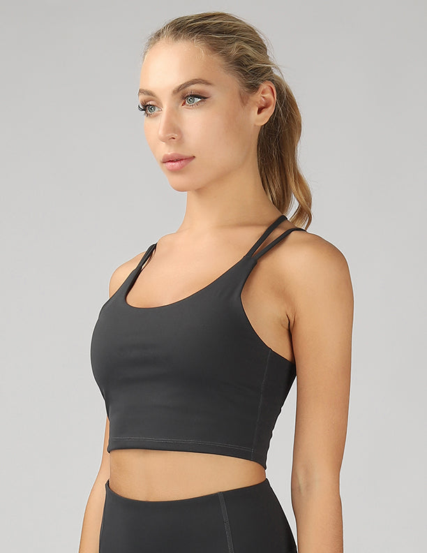 A stylish split shoulder strap crop top featuring a criss-cross back design, made from breathable 4-way stretch fabric.