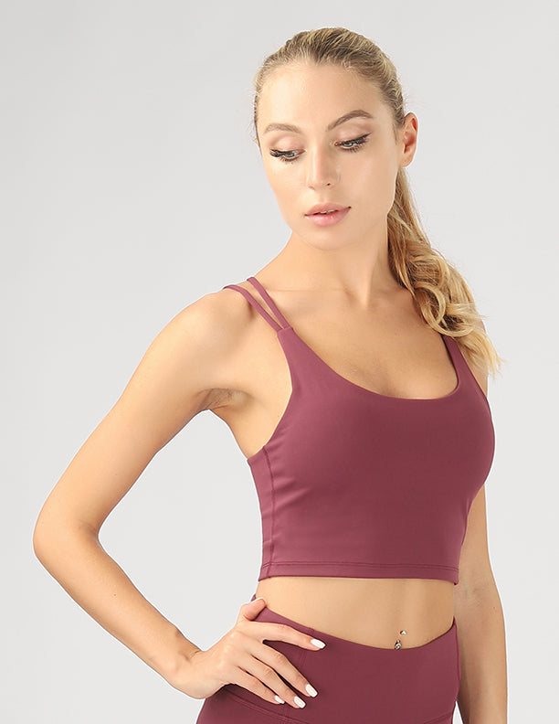 A stylish split shoulder strap crop top featuring a criss-cross back design, made from breathable 4-way stretch fabric.