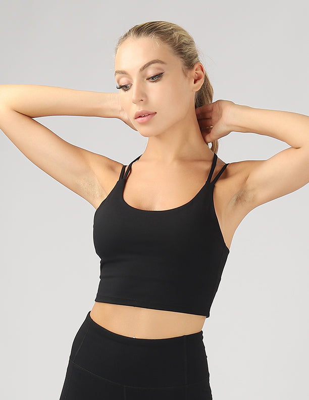 A stylish split shoulder strap crop top featuring a criss-cross back design, made from breathable 4-way stretch fabric.