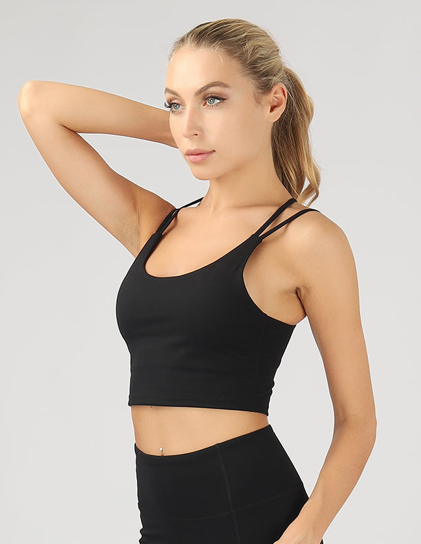 A stylish split shoulder strap crop top featuring a criss-cross back design, made from breathable 4-way stretch fabric.