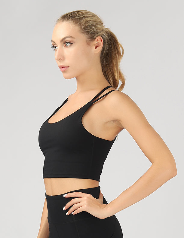 A stylish split shoulder strap crop top featuring a criss-cross back design, made from breathable 4-way stretch fabric.