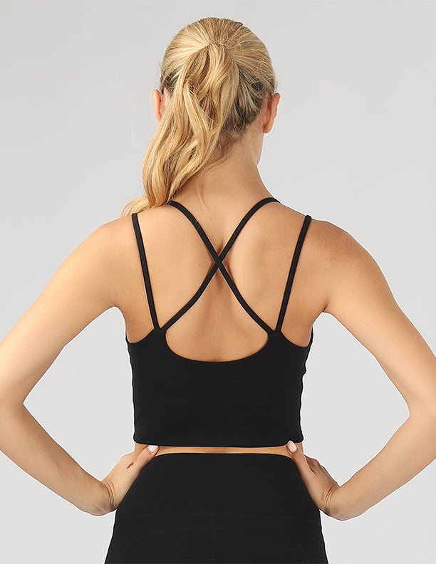 A stylish split shoulder strap crop top featuring a criss-cross back design, made from breathable 4-way stretch fabric.