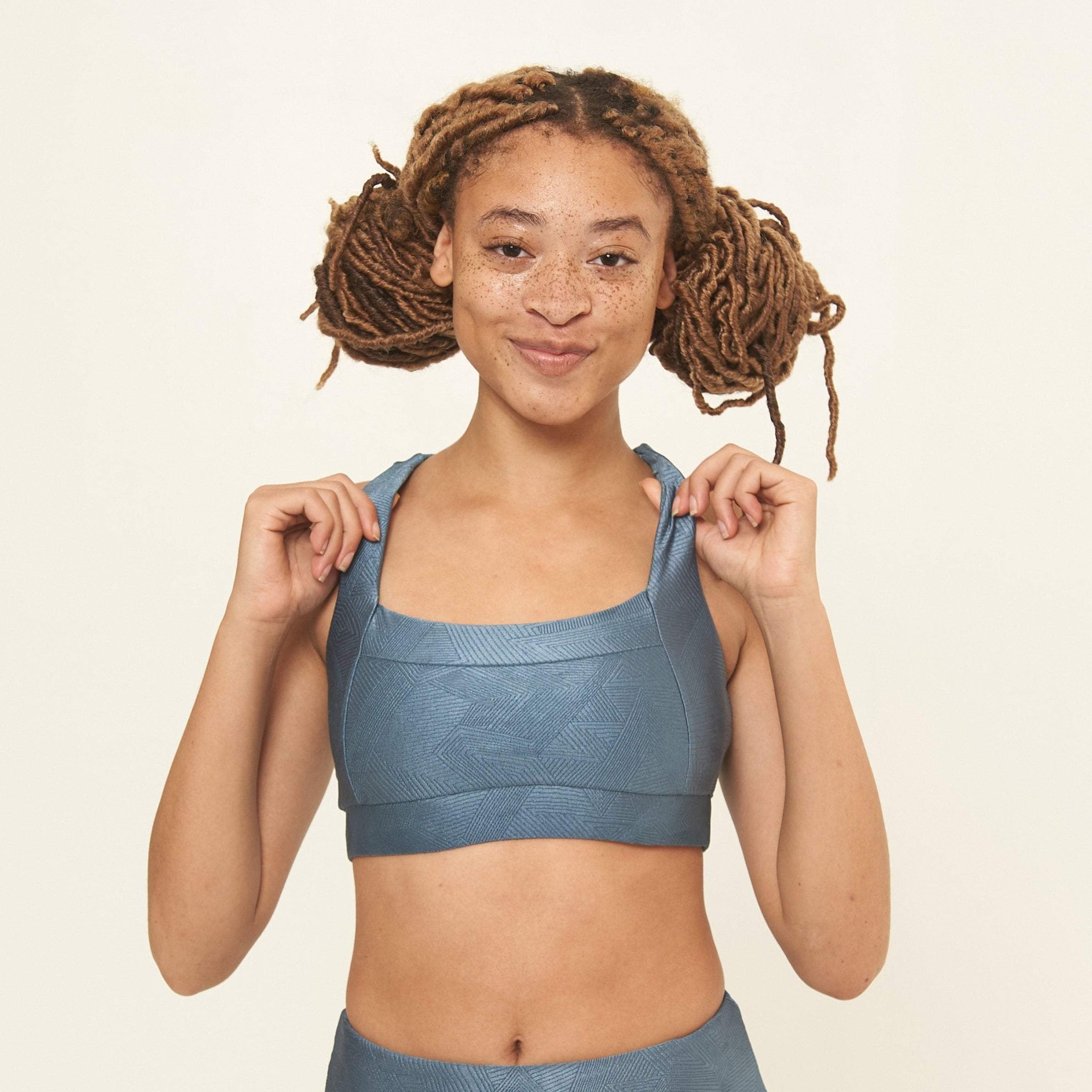 Lola Getts® Square Neck Performance Bra in Slate Blue Geo Pattern, featuring a stylish design and supportive fit for workouts.