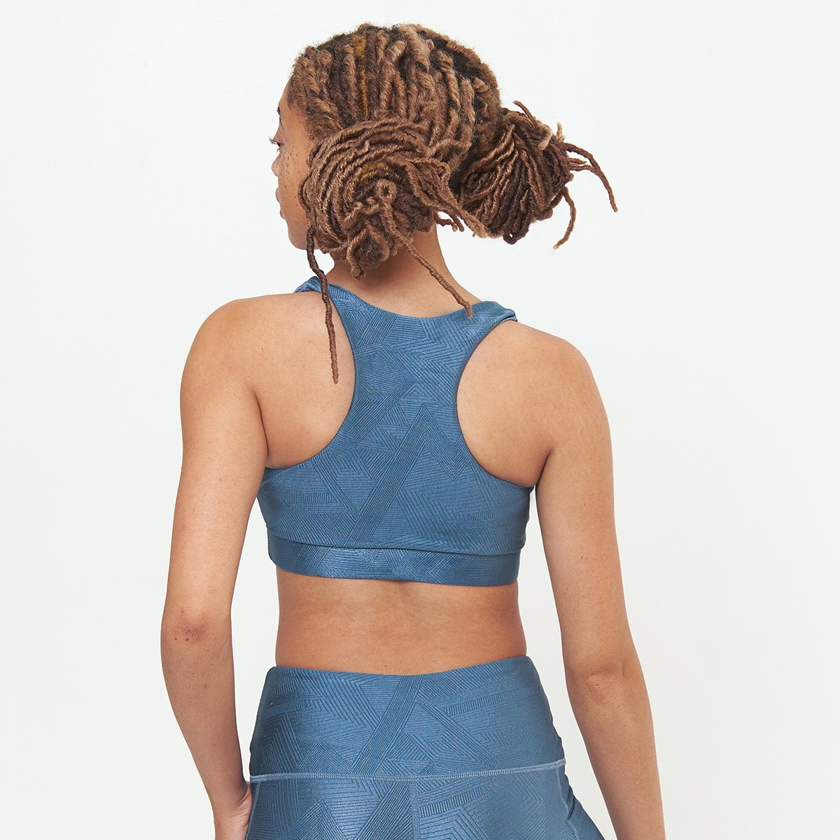 Lola Getts® Square Neck Performance Bra in Slate Blue Geo Pattern, featuring a stylish design and supportive fit for workouts.