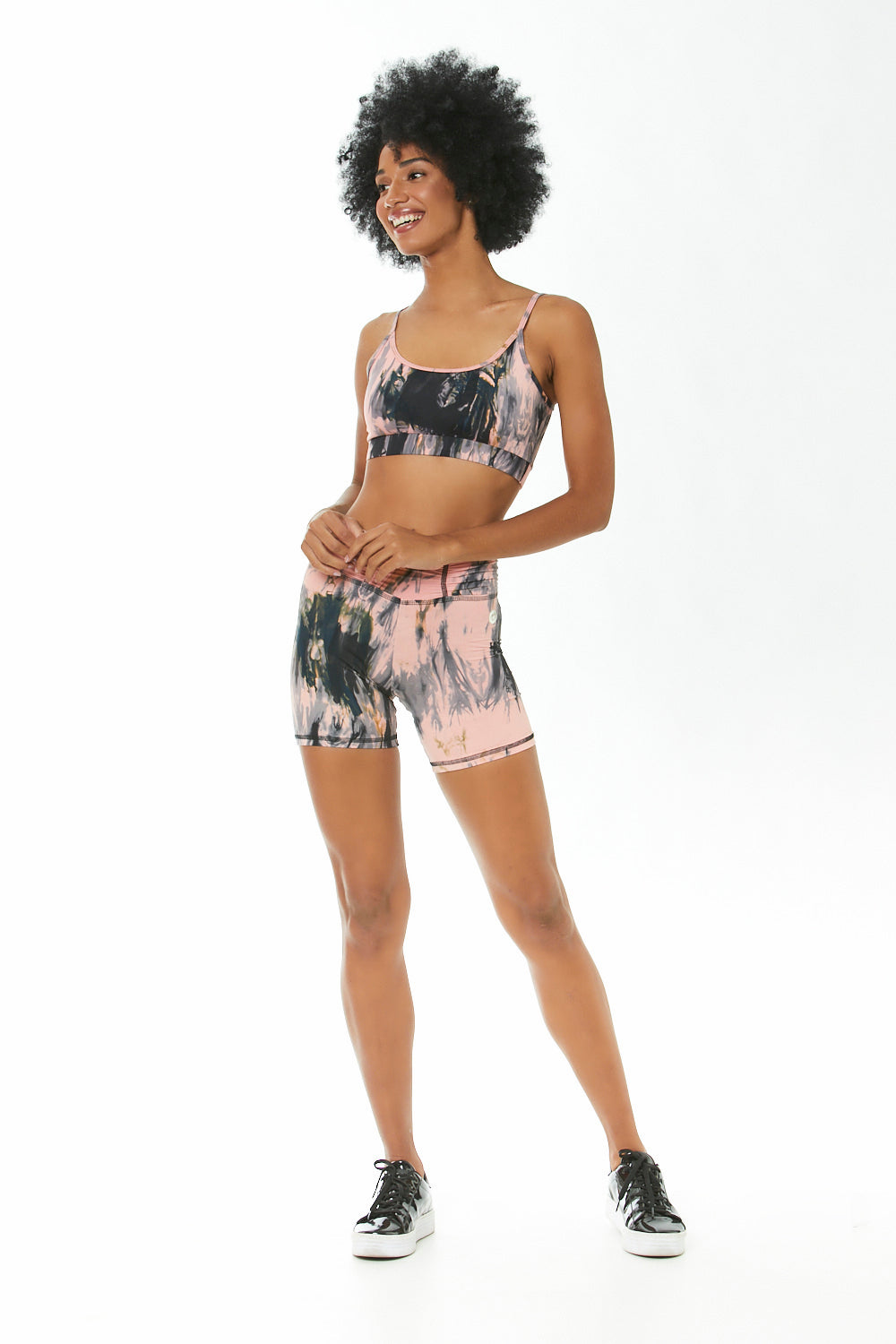 A pair of Storm Tie Dye High Waisted Shorts featuring a vibrant tie-dye pattern, high waist design, and soft Light Plus fabric, perfect for workouts.