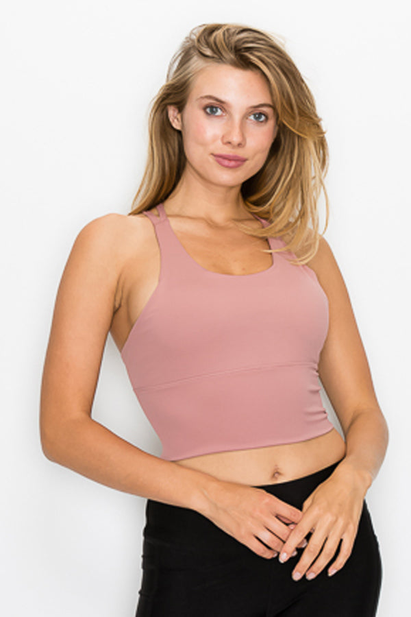 A stylish Strappy Back Crop Top featuring a trendy strappy back and corset tie at the waist, perfect for active wear.