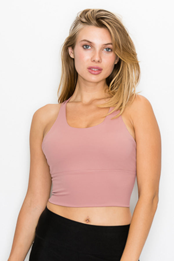 A stylish Strappy Back Crop Top featuring a trendy strappy back and corset tie at the waist, perfect for active wear.