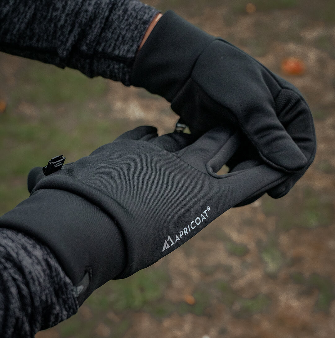 A pair of eco-friendly thermal gloves made from recycled polyester, showcasing their lightweight and stretchy design, perfect for outdoor activities.