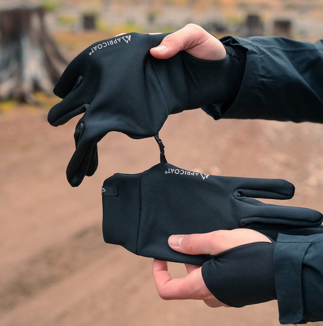 A pair of eco-friendly thermal gloves made from recycled polyester, showcasing their lightweight and stretchy design, perfect for outdoor activities.