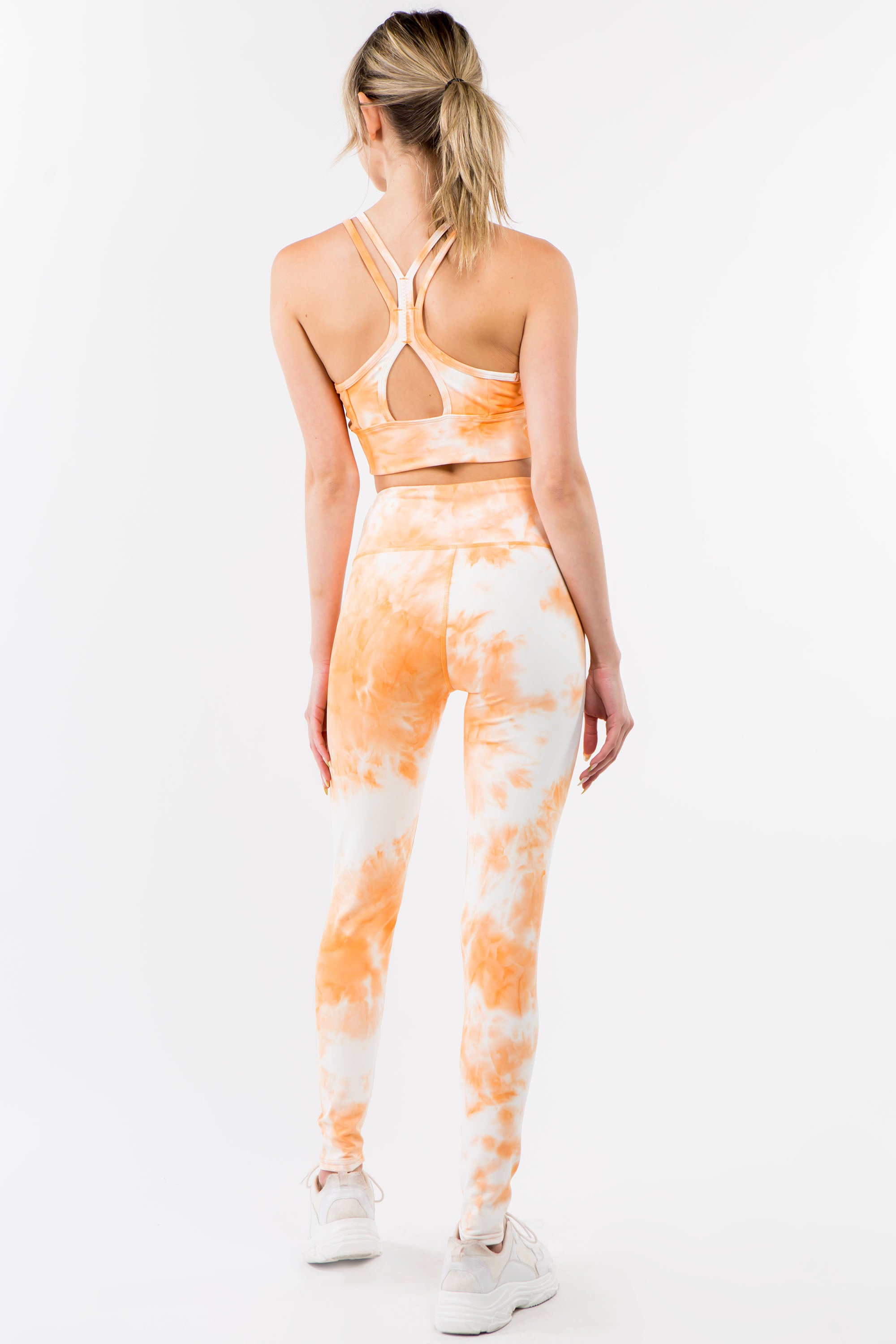 Tie-Dye Activewear Set in Orange Cream featuring a racerback bra and high-waisted leggings, perfect for workouts and casual wear.