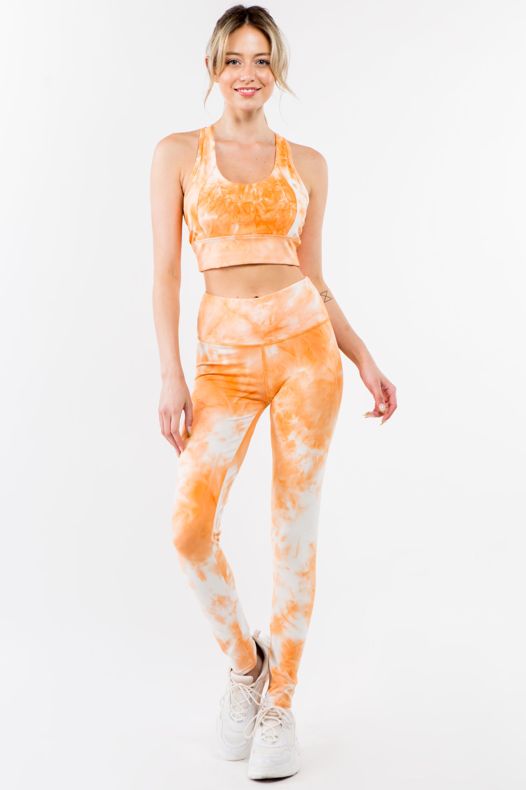 Tie-Dye Activewear Set in Orange Cream featuring a racerback bra and high-waisted leggings, perfect for workouts and casual wear.